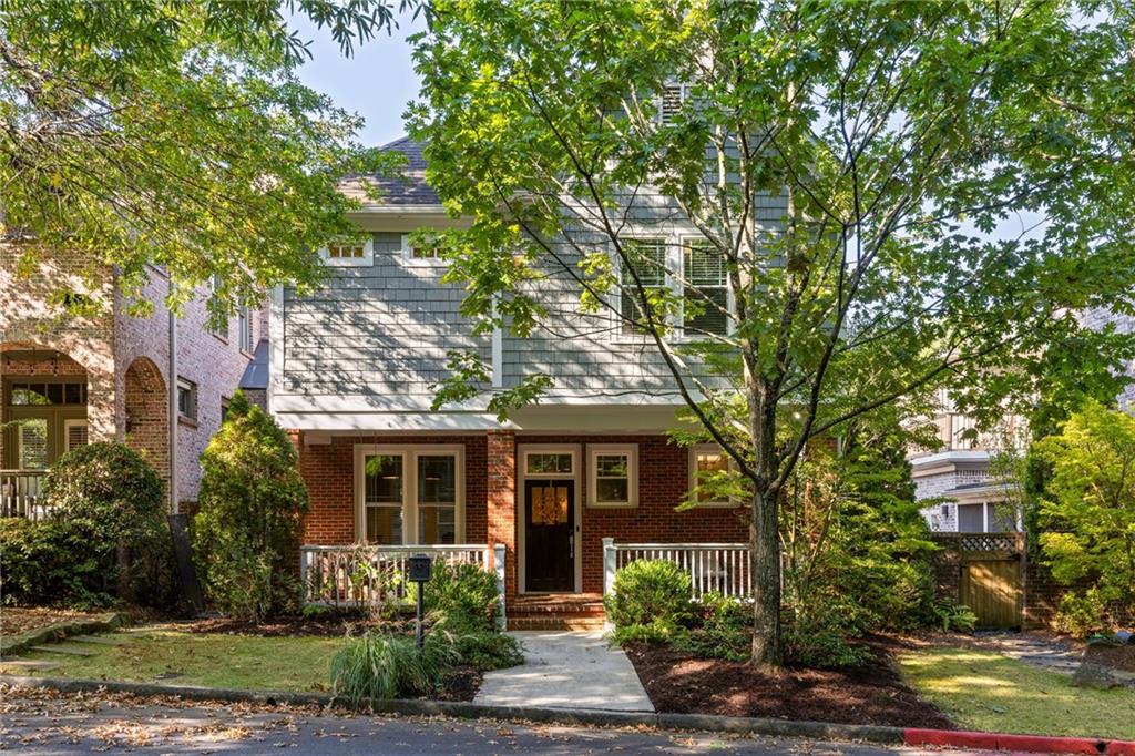 Set on one of Lake Claire’s most charming streets, this Sutherland Place home is an everyday escape where style, comfort, and effortless living meet. The main level welcomes gatherings with a bright open kitchen that flows into dining and living spaces, anchored by a gas fireplace - perfect for weekend brunches, cozy movie nights, or casual evenings with friends. Step outside to your private courtyard designed for summer grilling, al fresco dinners, and long nights under twinkling lights. A flexible space on the main level provides room for a dedicated office, library, or quiet sitting area. Upstairs, the oversized primary suite is a true retreat. Curl up with a book in the sitting area, decompress in the spa-like bath with dual vanities, soaking tub, and tiled shower, then step into an expansive walk-in closet where every outfit has its perfect place. Two additional bedrooms with en-suite baths offer comfort and flexibility for guests, a home gym, or a creative studio. A dedicated laundry room with a utility sink and ample storage makes weekly chores simple. Fresh paint, designer lighting, and clean modern finishes create a polished backdrop throughout, while a two-car garage and community-maintained grounds make life effortless. Zoned for Mary Lin Elementary, enjoy easy strolls to Lake Claire Park, Lake Claire pool, the PATH, and Pullman Yards. Picture morning coffee on the porch, sunset drinks in the courtyard, weekend gatherings with friends, and quiet nights in your private suite.