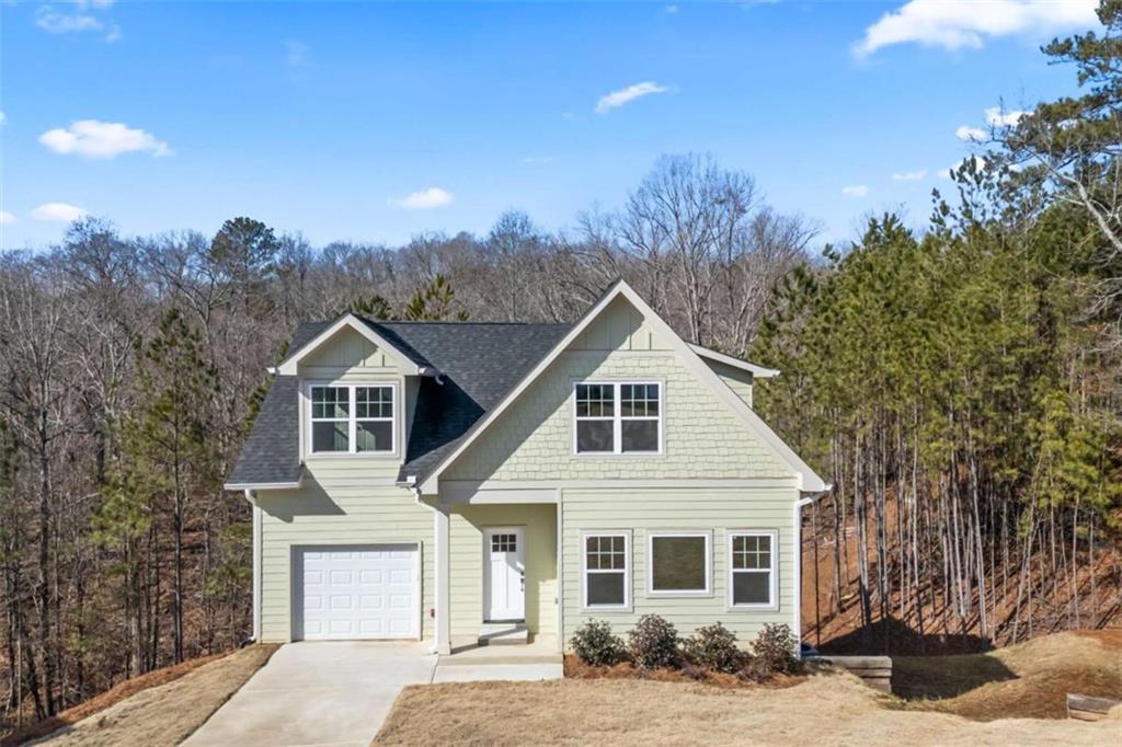 This stunning NEW CONSTRUCTION home is a true charmer, featuring elegant Shake accents that enhance its inviting curb appeal. Offering 3 bedrooms and 2.5 baths, this home is designed for both style and functionality. Step inside to an open-concept living space filled with natural light from an abundance of gorgeous windows. The seamless flow from the living area to the dining space and kitchen makes it perfect for entertaining. True hardwood floors run throughout, while the bathrooms and laundry room are beautifully finished with tile. The bright and airy kitchen boasts white soft-close cabinetry, stainless steel appliances, and a charming Butler's Pantry with prep and display space, along with an impressive walk-in pantry. A convenient half bath is also located on the main level. The tandem garage features an epoxy-coated floor for durability and style, and just inside, a small drop zone adds extra convenience. Upstairs, you'll find three spacious bedrooms, including a luxurious Primary Suite with a generous walk-in closet that flows into the Primary Bath, complete with a large tiled shower and double vanity. A tiled tub/shower combo serves the secondary bath, while a spacious laundry room adds ease to everyday living. The full unfinished basement provides endless possibilities for customization. Don't miss the chance to make this beautiful home yours. PRICED UNDER APPRAISED VALUE!