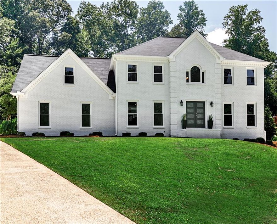 Welcome to this luxuriously elegant five-bedroom residence, where tasteful design meets modern comfort, and every detail has been thoughtfully curated. Offered fully furnished with premium designer pieces, this home provides a true turnkey living experience of exceptional quality and style.
Step through the double front doors into a soaring two-story foyer, where rich hardwood floors flow seamlessly across the main level. To your right, a refined office/parlor offers the perfect peaceful workspace; to your left, a sunlit dining room connects effortlessly to the beautifully appointed eat-in kitchen and breakfast nook, each with tranquil views of your private backyard retreat. The spacious family room invites relaxation and opens onto an expansive screened veranda with fireplace, overlooking the outdoor fire pit, perfect for crisp evenings or hosting friends on game day. Upstairs, you'll find a convenient laundry room, four generous bedrooms, and two full baths, including a spa-inspired owner's suite designed for ultimate comfort and retreat. The finished terrace level is a true highlight, featuring both interior/exterior entrances as well as its own driveway. This level offers an oversized bedroom with private en-suite bath, a game/living room, sleek kitchenette with bar seating, additional laundry center, half bath, and a golf cart garage. A golf cart is included for quick trips to the community pool, tennis, and pickleball courts! This versatile space adapts beautifully as a teen or in-law suite, entertainment hub, or income producing opportunity. All of this comes with the added charm of Milton and Alpharetta just minutes away, plus the benefit of lower Cherokee County taxes.