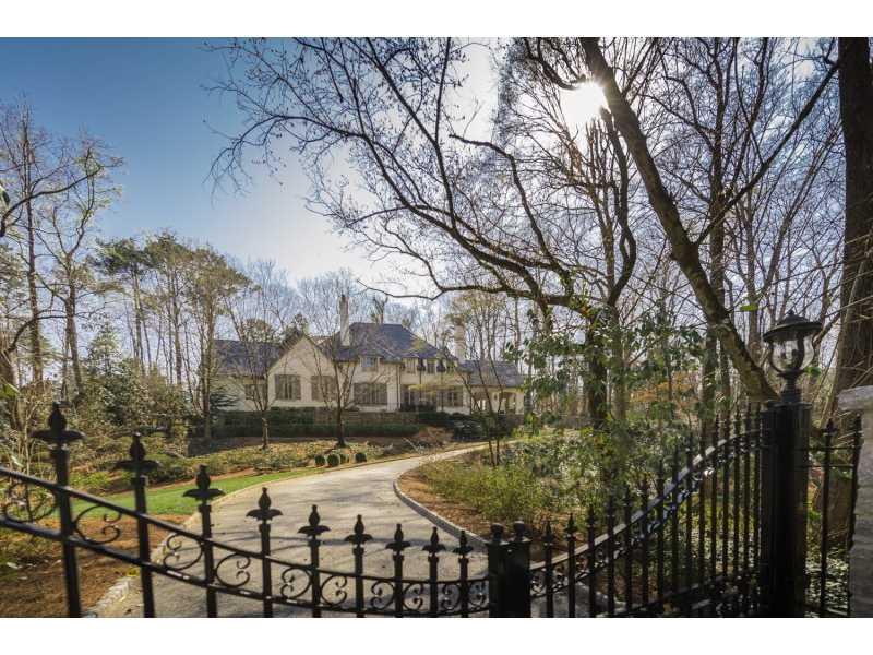 French Manor Estate on one of Atlanta's most coveted streets. Completed in 2008 -quality abounds in this architectually beautifully planned home. Offering 'something for everyone'! A main level luxurious mstr suite w/his & her baths, 5 spacious upper level suites. A wine cellar, gym, family room, media rm & bar complete the terrace level. The kitchen/family rm, outdoor 'living room', walkout pool and master suite truly further makes for a 'one of a kind' very special property. Upper suite w/sep exterior door. Expansive outdoor lighting.