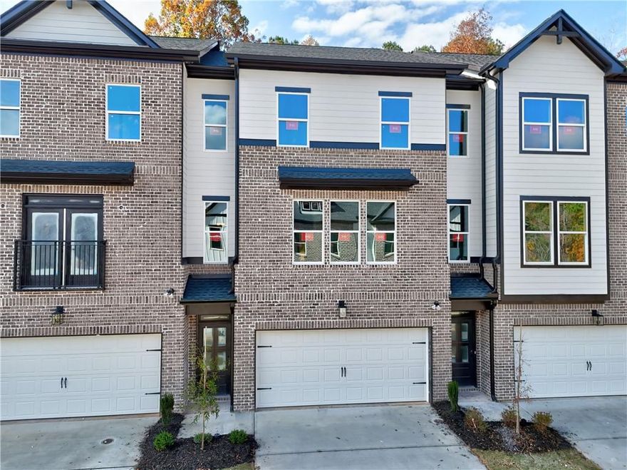 Richardson Housing Group – the Kinsley floor plan, a 5-bedroom design with a private covered back deck in the gated community of Parkstone Row in Tucker, GA. This exclusive 33-home neighborhood is ideally located just 12 miles northeast of Atlanta and offers quick access to I-85, I-285, and Highway 78, placing shopping, dining, parks, and local events all within convenient reach. Parkstone Row is also located in the highly regarded Parkview High School District, making it a top choice for buyers seeking quality schools and convenience. The homes in Parkstone Row feature a premium list of modern finishes that outshine the competition. Brick exteriors with cedar accents, 3/4 view front doors, and 30-year architectural-style shingle roofs create curb appeal and long-lasting value. Inside, you'll find designer kitchens with quartz countertops, shaker-style cabinetry, stainless steel appliances, subway tile backsplash, and pendant lighting over the island. High-end details continue throughout with 1x6 baseboard trim, 1x4 door casings, 1x4 window surrounds, 5-panel interior doors, flat-panel wainscoting in the foyer and dining area, black hardware and fixtures, oak site-finished stained hardwood stairs, and fully tiled master showers on the floor and walls with frameless glass doors. LVP flooring extends through the main level and continues upstairs in the common areas, providing both durability and style where it’s often overlooked. All 3 levels feature 9-foot ceilings, and the main level is enhanced by 6-foot-tall windows that fill the space with natural light. Each home also includes an electric vehicle charging outlet. HOA dues cover lawn maintenance, termite bond, and select exterior building maintenance, offering a low-maintenance lifestyle in a secure, gated setting. This home is under construction; photos of a finished home are not available for this floor plan. The photos shown are of the actual home currently listed for sale and will be updated as construction advances. Ask about up to $10,000 in closing cost incentives when using an approved lender, plus options for 100% financing or a 1% below-market interest rate.