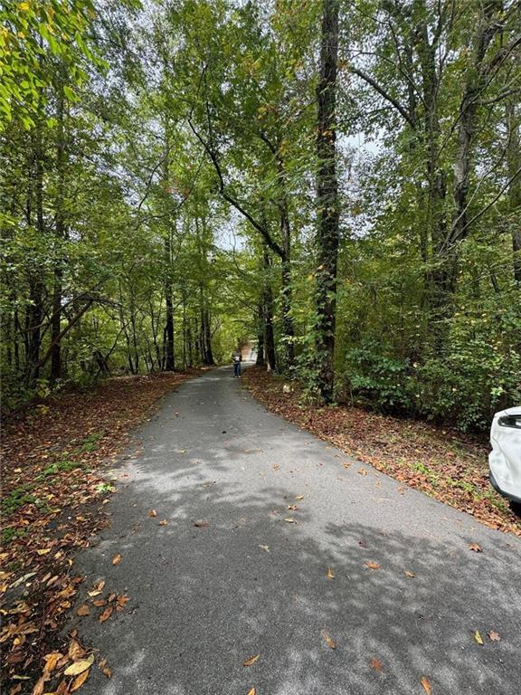 Time to build your Dream Home on this Beautiful, Wooded 5.68 Acres in Northeast Paulding County. Close to Downtown Dallas, Restaurants, Shopping, and Entertainment. Easy access to Cartersville and Acworth. The property is bordered by a creek on 2 sides with 160 feet of road frontage on Old Cartersville. Great Schools. Quiet, country living, you will love this property! Paved Easement located on the property for land behind this acreage.