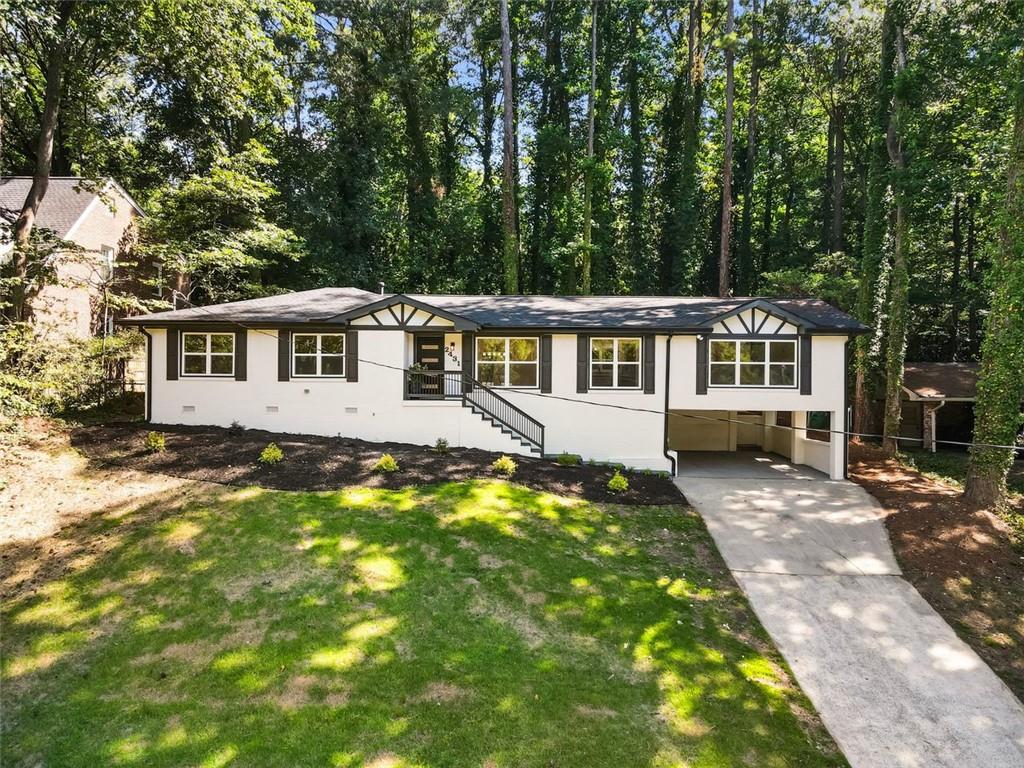 Fully Renovated Mid-Century Gem in Prime Atlanta Location — Ready to Move In!
Welcome to 2431 Nancy Lane NE, a stunningly reimagined 4-bedroom, 3-bathroom brick ranch located in the highly sought-after Shallowford Heights neighborhood of Atlanta. Set on a spacious 0.33-acre lot, this home seamlessly blends timeless mid-century charm with top-to-bottom modern upgrades and designer finishes.
Step inside to a bright open-concept layout featuring engineered hardwood floors, a cozy fireplace, and a chef-inspired kitchen outfitted with a large island, quartz countertops, brand-new soft-close cabinets, and all new stainless steel appliances, including a refrigerator, cooktop, double oven, and dishwasher. Whether you're entertaining or cooking a weeknight meal, this space is designed to impress.
The luxurious primary suite offers a peaceful retreat with a spacious walk-in closet and a spa-style bathroom showcasing dual his-and-her showers, a center rainfall shower, modern LED lighting, and elegant designer tilework. All three full bathrooms have been fully remodeled with upscale finishes and thoughtful touches throughout.
Notable Upgrades:* Brand-new Trane high-efficiency HVAC system * New roof and gutters * Fresh interior and exterior paint * Upgraded insulation * Energy-efficient new double-pane windows and doors * All new stainless steel appliances (refrigerator, cooktop, double oven, dishwasher) * New soft-close cabinetry throughout * Fully upgraded restrooms with modern tile, fixtures, and LED lighting * Engineered hardwood floors throughout.
Enjoy the private, level backyard, ideal for outdoor entertaining, relaxing, or gardening. Perfectly located just minutes from Emory University, the CDC, CHOA, I-85, and top-rated restaurants, parks, and shopping destinations.
Zoned for Hawthorne Elementary, Henderson Middle, and Lakeside High, with nearby access to The GLOBE Academy and optional Echo Ridge Swim & Tennis Club membership, this property offers a rare blend of location, and luxury.
This move-in-ready masterpiece is the total package—schedule your showing today!