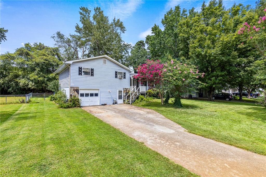Rare opportunity to buy in highly desired Lawrenceville for under $250K!  This home is a great opportunity for DIY-ers and investors alike. The floor plan is perfect for families or roommates. 3 bedrooms and 2 bathrooms, and additional unfinished area in basement ready to be finished and add instant value! The home does need TLC. The roof and A/C were replaced in 2022. New siding and tile was purchased for the home and is currently stored in the basement, ready to be installed! So bring your tool belt and your vision to make this house your new home! The house is being sold AS-IS.
