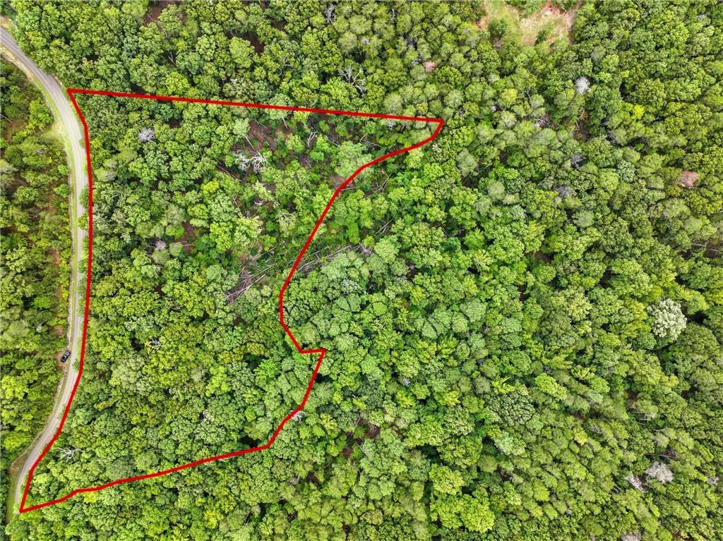 Discover the perfect setting for your mountain dream home on this beautiful 3.56-acre lot in the gated community of The Preserve at Sharp Mountain. Tucked within a serene wooded landscape, this property offers multiple building spots to suit your vision. A gentle creek meanders the land, adding to its natural charm and peaceful ambiance. Located close to the community’s back gate, you’ll enjoy both convenience and privacy. Residents of The Preserve at Sharp Mountain have access to an array of amenities, including scenic hiking trails, a community park, picnic areas, abundant wildlife, and breathtaking long-range vistas. This lot combines the best of nature and neighborhood, offering a tranquil retreat just minutes from town.