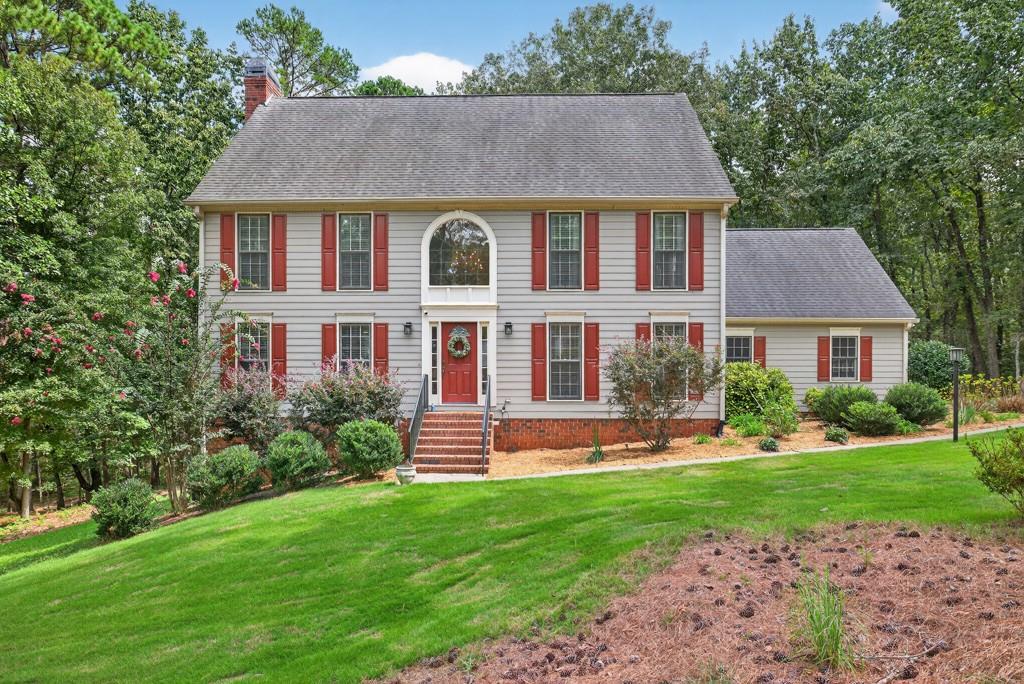 Welcome to this elegant Traditional Home on a Spacious 1.83-Acre Wooded Lot within very close proximity to Downtown Winder. This home features 3 bedrooms, including a spacious primary suite, 2 full baths, 2 half baths, and a bonus/flex room that could be used as a 4th bedroom. Discover the perfect blend of character, space, and privacy in this traditional-style home nestled on a partially finished basement. Set on a beautiful wooded lot, this property offers serene natural views and the peace of an established neighborhood, where pride of ownership shows throughout. Enjoy views of beautiful landscaping, and wait for visits from various wildlife. Inside, you'll find a timeless floor plan designed for both everyday living and entertaining that includes spacious living areas, inviting bedrooms, a relaxing sunroom, and endless potential for customization. The basement provides excellent storage, workshop space, additional living, or entertaining area, and a half bath. Located in a true homeowner association community, residents enjoy a sense of connection, and well-maintained surroundings that make this area highly desirable. The mature trees, winding streets, and established feel add to the charm and appeal of this property. If you're looking for a home with traditional style, privacy, and room to grow, all in a welcoming community, this is the one you've been waiting for!