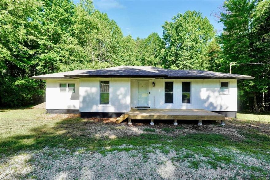 SHORT SALE & RECENTLY RENOVATED. Nestled on 1.3 acres, this charming 3-bedroom, 2-bathroom home perfectly blends historic character with modern convenience. Step inside to an inviting open floor plan that seamlessly connects the living spaces, offering a cozy yet spacious feel. The well-appointed kitchen is designed for both everyday living and entertaining, featuring ample cabinetry and modern appliances. Outside, the expansive yard provides plenty of privacy and space for relax.  Behind the house is a nice sized storage shed or workshop which may have been used at one time for farm animals, wood working and would make for a great garden house. With no HOA, you have the freedom to truly make this property your own. Located in a peaceful, private community, yet just minutes from local amenities, this home offers the best of both worlds-tranquil country living with modern conveniences nearby. Don't miss this opportunity to own a beautiful home with room to grow and endless possibilities!