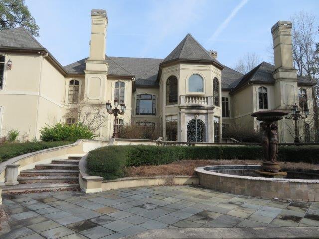 Tremendous opportunity to return one of Buckhead's finest estates to it's full glory! Gated on 5 acre lot! Grand foyer with fireside sitting area! Formal dining room & separate formal living room with coffered ceiling! Full butler's pantry with appliances! Spectacular kitchen with high end appliances, huge island, & large breakfast nook! View to fireside family/keeping room! Beautiful guest bedroom on main with sitting area & private bathroom featuring his & her vanities, huge shower, & separate tub! Master suite features steep vaulted ceiling and fireplace! Private master bathroom features wet bar, extended his & her vanities, luxurious shower, separate soaking tub, fireplace & separate his & her water closets! Master closets feature custom built-in cabinetry with gorgeous displays! Three secondary bedrooms upstairs each with private full bathrooms! Home gym upstairs with sauna! Full basement with large bar for entertaining, multiple living spaces, theatre room, ballroom, rec/bonus rooms, & a guest suite with private, full bathroom! Backyard oasis features large patio overlooking the in-ground pool and spa! Separate gazebo/cabana with bar is the perfect entertaining space! This is a MUST SEE! Don't miss out!