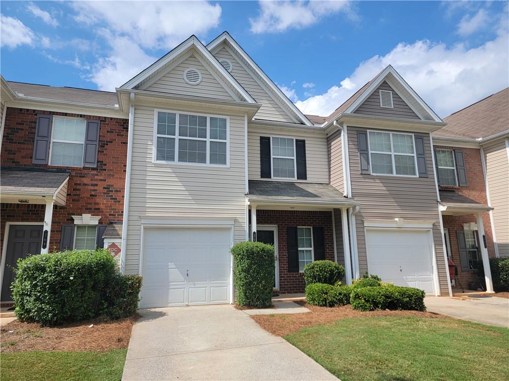 Totally revamped fee simple townhouse made to be like new!! New roof, New carpet, New paint, New granite counters!! Wyngate is a private gated entry community packed full of great amenities including: sidewalks, gorgeous swimming pool & cabana, tennis, pickleball and basketball courts, fenced in dog park, playground, picnic area, and ample guest parking. Wyngate is a great live/work/play designed community with very low HOA dues. Located within walking distance to shopping and dining, close to GA400 exit 14, Northside Forsyth Hospital, Lake Lanier, Cumming City Center (free concerts) and highly rated Forsyth county schools. This 3 bedroom unit has the largest floor plan in the community with a double vanity primary suite bath including separate shower and soaking tub. Family room gas fireplace features one switch control. Kitchen features a gas range, fridge, and new granite counters, sink and fixtures. The upstairs laundry is near the bedrooms. Clothes washer and dryer are included in the sale. Covered front porch entry and patio in back. Enclosed garage and level private driveway, enough space to park 3 cars on the property, in addition there is guest parking spaces. Get ready to move into a "turn key" property in a lovely community, full of country club amenities, located so close to everything that you want to do!!! Please remove shoes before walking on the newly installed carpet!!