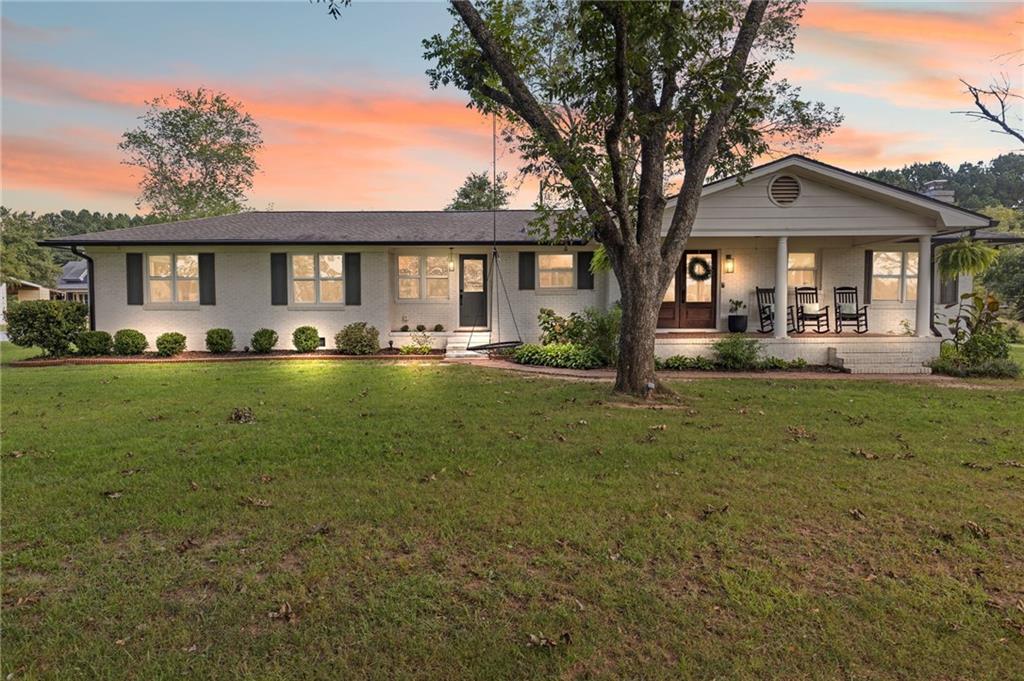 Sitting on almost 3 ACRES, this fully renovated 1945 ranch is the kind of place that just feels like home.
The kitchen steals the show as soon as you walk in with timeless hardwood floors, a custom hood vent, cozy banquette seating, and a fireplace of its own. The spacious living room continues the charm with a rounded fireplace and beamed ceilings that add character and warmth.
The split-bedroom layout gives everyone their own space, with a roomy primary suite that even has a private office—perfect for working from home or easily converted into dream dual closets. Three additional bedrooms are all generously sized, including one that was recently designed as a second primary suite with a beautifully designed bathroom. The original hardwoods bring warmth to the bedrooms, and the secondary bath’s vintage green tub is a fun nod to the home’s history.
Outside, there’s plenty of room to relax or entertain. Acres of room, actually. The brand-new 20x40 deck is ready for fall football parties, cookouts, or quiet mornings with coffee in hand. The 16x32 wired shop is the ultimate bonus space—ideal as a workshop, toy storage, or even a home gym. All major mechanicals are from 2020 (Roof, HVAC, water heater and septic system)!
With its thoughtful updates, character-filled details, and wide-open land, this home has the best of both worlds—modern comfort wrapped in timeless charm. This is more than a house—it’s the perfect place to call home. Appraisal available.