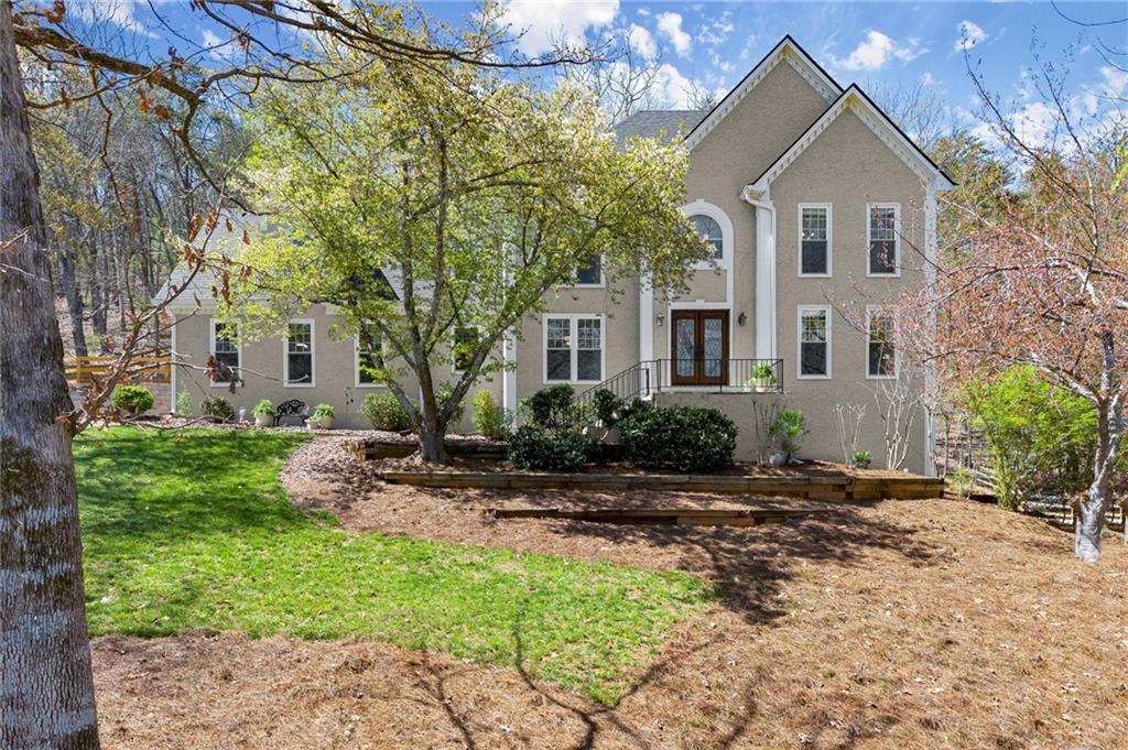Located in the highly sought-after Lassiter school district, this Highland Pointe home features an oversized owner’s suite and a finished terrace level with tray ceilings, fireplace, wet bar, mini kitchen, and guest bedroom—ideal for entertaining or extended stays. The owners have invested over $100K to create a partially leveled flat backyard framed by two custom-built stone retaining walls, a fenced area with three access gates, flat ceilings throughout, smart systems, and core infrastructure improvements. These thoughtful upgrades deliver both modern comfort and long-term peace of mind.
