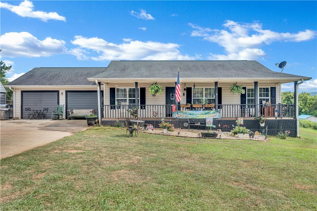 This charming 4-bedroom, 2-bathroom ranch offers 1,750 square feet of comfortable living space on a generous .73-acre lot, featuring a spacious front and backyard, a welcoming covered front porch, and a back deck perfect for outdoor enjoyment. Inside, the living room boasts hardwood-style flooring, tall ceilings, and a cozy fireplace, while the kitchen showcases warm stained cabinets, a pantry, and a bright eating area. The large master bedroom on the main level is filled with natural light from two walls of windows and is complemented by two nearby bedrooms and two full baths. Adding extra flexibility, the converted garage has been transformed into a private-entry studio apartment complete with its own bedroom and living area—ideal for guests, rental income, or a home office. Located just minutes from downtown Jasper with convenient access to the interstate, this property blends space, comfort, and location in one attractive package. This property won't be available for long... schedule your showing today!!