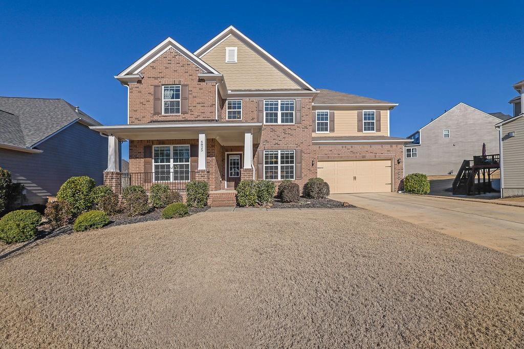 Nestled in the sought-after Ashford Manor Subdivision and the highly rated Denmark High School District, this meticulously maintained 5 bedroom/4.5 bathroom home offers exceptional living spaces and modern conveniences. The main level boasts beautiful hardwood floors, private office space, 2 story foyer, and open concept design connecting the living room sunroom, and chef's kitchen! The kitchen is an entertainers dream and includes a large island, stainless steel appliances, walk-in pantry, stone countertops, tile backsplash. Don't miss the mudroom and business center as an added bonus! A private guest suite with a walk-in closet and en suite bathroom provides comfort and privacy, completing the mainlevel accommodations. Upstairs, you'll find a versatile loft area and four spacious bedrooms, including an oversized master suite with a soaking tub, tile shower, dual vanities, and his-and-hers closets. Secondary bedrooms include a Jack-and-Jill bathroom and another with a private bath. The unfinished basement is pristine and ready for your custom finishes, complete with bathroom stub-outs. Outdoor living is a delight with a large back deck overlooking the well manicured backyard. Additional highlights include a cozy fireplace on the main level, a spacious two-car garage, and a prime cul-de-sac lot. Conveniently located near GA-400, Halcyon, Avalon, and Fowler Park! Don't miss your chance to call this home! Call today for your private showing