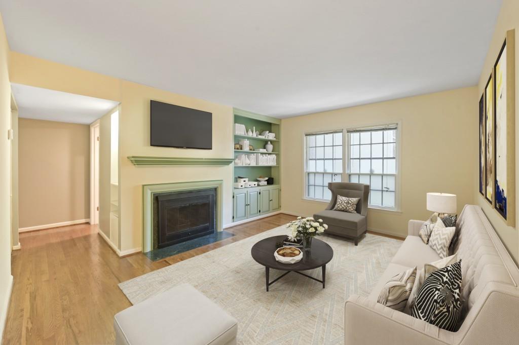 A lovely condo in the peaceful, wooded Cross Creek Condominium has come to market. With a floor plan that allows for open plan living, enjoy the coziness of a wood-burning fireplace, built-in bookcases and a wall of windows in the sunroom that feel like a 'wall of trees'. This pristine condo boasts wooden floors throughout with tile in kitchen. Condo amenities include gated and secure community, golf course, clubhouse, catering kitchen, fitness center, 3 swimming pools, tennis court and pet walk. Convenient to all Atlanta has to offer with easy access to I-75, Westside Park at Bellwood Quarry, Midtown, Buckhead, Vinings and 20 minutes from Hartsfield International Airport. The HVAC and water heater are less than 5 years old. All kitchen appliances and stacked washer/dryer stay in this freshly painted, move-in ready condo. This one will go fast!