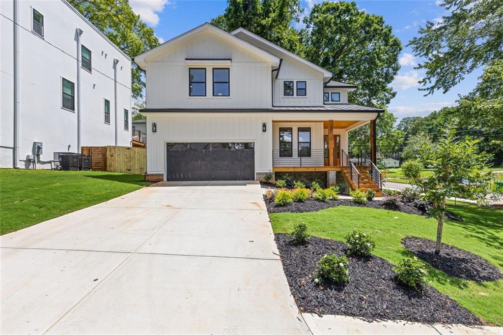 Welcome to 3155 Zion Street, a newly constructed modern farmhouse offering four bedrooms, three and a half bathrooms, and a flexible office or bonus room. This home features an open concept layout with hardwood floors, quartz countertops throughout, and a spacious kitchen with a large island ideal for entertaining. The living room includes a sleek linear gas fireplace as a focal point. The oversized primary suite provides a walk-in closet and a spa-inspired en suite bath. Additional highlights include a two-car garage, dedicated laundry room, rear deck, and private backyard. Located near the Stone Mountain PATH Trail with connections to the Decatur PATH and Atlanta BeltLine, and within walking distance to shops, dining, and Town Green Park in Avondale Estates. A renovation of nearby Cedar Park is underway, further enhancing the area. Enjoy convenient access to Decatur, Emory, Midtown, and Buckhead. Offered at $735,000, this thoughtfully designed home blends modern style with everyday functionality in a well-connected location.