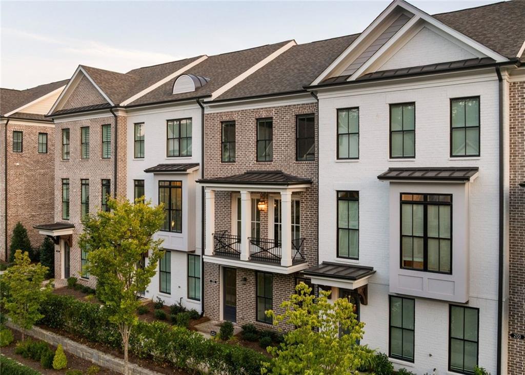 From great shopping at Avalon, to wonderful dinners on the Alpharetta square and connecting them all is the 7-mile Alpha Loop that is conveniently located directly across the street from the epitome of luxurious living - Welcome Home to 220 Briscoe way, the Brownstone Collection at Towns on Thompson. Moments from all the hottest spots in Alpharetta, yet world's away, in a thoughtfully designed retreat that captures every hope you've dreamed in modern townhome living. Wide plank hardwood floors, double french doors leading to the peaceful front balcony overlooking Thompson street, to the high ceilings with artisan lighting and smart home dimmer switches throughout! One of the BEST floorplans you'll find in Downtown Alpahretta- this truly is an true entertainers dream. With a massive kitchen island, 36" gas cooking, wine fridge + dry bar, tremendous storage (don't miss under the island!) and a wide, open concept flow, leaves plenty of dedicated space for all your introverted and extroverted guests! The upcoming Holiday parties you're about to host will be the hottest talk among all your friends and family! High tech touches like the "one-click" automatic custom blinds throughout the entire home, are designed for an easy night in, once all your guest have left and it’s time to unwind. Luxury finishes and customized smart home details across all three levels. Portions of the builder's 2-10 warranty remain + all the TV's and Sonos sound systems are your new home starter pack for easy living on Thompson street. Not to mention, the upgraded "High Clearance" garage door rails ideal for SUV trunk openings, to unload your latest haul from Avalon or Whole foods just around the corner! The best floorplan, in the most highly sought after location, with all the details you expect in luxury living - is an exceptional recipe for your brightest days ahead!!