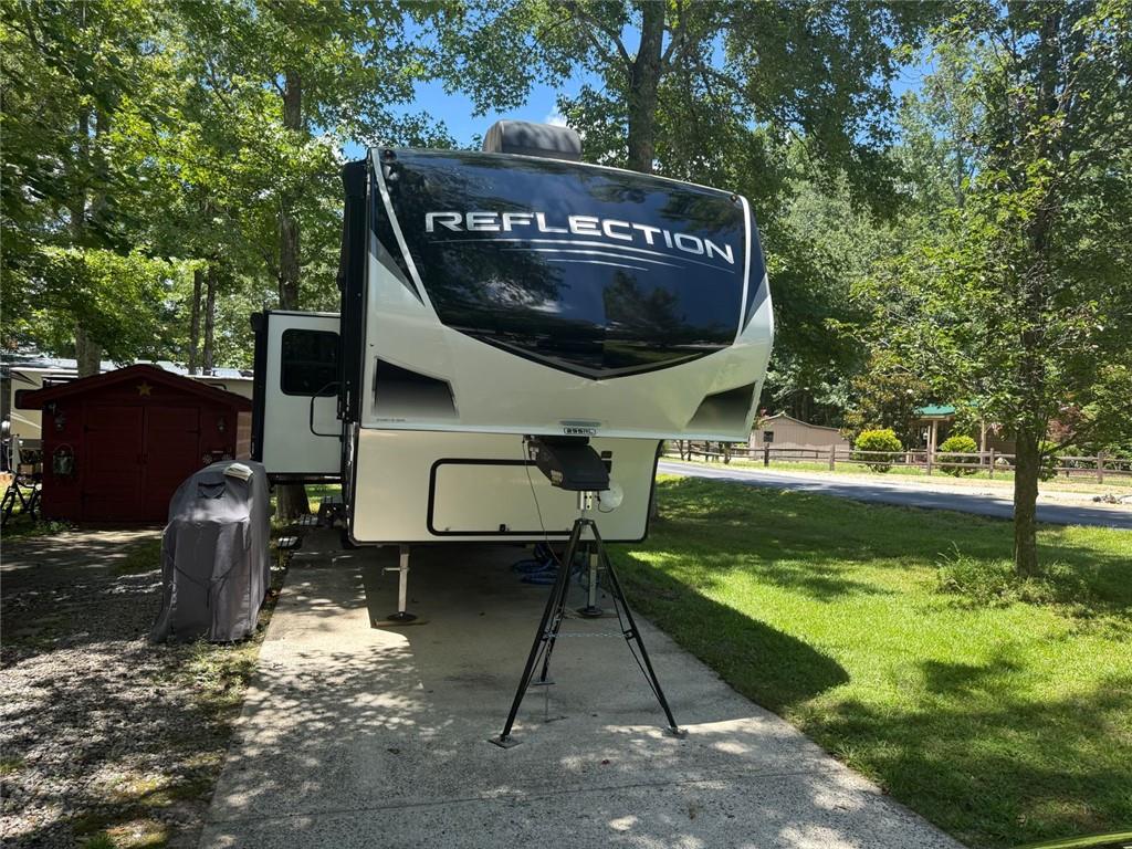 One of the most inviting campers you will ever walk into. High ceilings beautiful finishes great floor plan. Everythging you need and in one of the best campgrounds around. This 33 ft Camper that is just like it came off the showroom floor. It is immaculate and so pleasant on the inside sits on a corner lot conveniently located close to the amenities.There is a storage building with electricity to put all of your extra things in.
The owner is including some things that you would not know you needed until you do with the sale of this camper. This is a really outstanding location and the lot is level and easy to maintain.