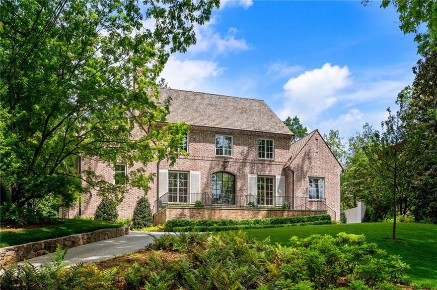 This stunning new home by Siegel Construction and Design seamlessly blends modern elegance with timeless charm. Located in Buckhead's Peachtree Heights neighborhood, the home features an expansive open floor plan, and was designed for both luxurious living and effortless entertaining. There are 6 Bedroom/6 Baths/3 Half baths in the main house, with an additional office/bedroom and full bathroom located above the detached garage that includes a small kitchen area. Interior features include a large home open floor plan, bright living spaces, clean lines, venetian plaster accents and 4" character grade white oak flooring throughout. The kitchen is open to the family room and features white marble floor countertops & backsplash, custom cabinetry, Sub-zero refrigerator, dual-fuel Wolf Range oven, and unlacquered brass hardware. There is a working pantry off of the breakfast room with panel front appliances including a pellet ice maker and secondary dishwasher. The study features a wet bar, masonry fireplace and a view into the wine cellar. Large, floor to ceiling iron windows with French doors open from the family room to the covered porch and pool area. The spacious primary suite is on the main level and has separate walk-in closets and water closets, and a corner iron window overlooking the pool and yard. The terrace level has a bedroom suite, recreation room, and a separate fitness room with rubber flooring. There are two separate laundry rooms - one on the main and one on the second floor. Exterior features include- custom brick Flemish bond brick pattern, copper gas lights, cedar beams, bluestone coping/patio and cedar shake roof. The backyard features a pool surrounded by lush landscaping and a built-in gas grill. The spacious covered patio with a brick fireplace provides a great spot for evenings outdoors. Less than 1/2 mile from Peachtree Battle shopping center and E Rivers elementary school.