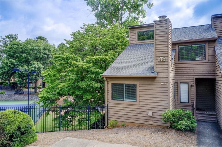 Fabulous location in East Cobb!  Walk to Kroger or bike to the Chattahoochee Boardwalk and Nature Park.  Sope Creek and Walton districts.   This end unit townhouse features soaring ceiling great room with corner fireplace.  Lots of windows.  Upstairs the primary bedroom is located on the back of the home with private bath and 2 closets.  The other bedroom features a ceiling fan and access to the hall bath.   Updated kitchen with stainless appliances and granite countertops with a wonderful walk in pantry.  Breakfast room with sliding door to the deck.  Downstairs is the real selling point.  Traditional bedroom with window and closet plus a very large room with builtins but no window that could be a 4th bedroom.  Full bath and large den complete the lower level.  All with access to the courtyard patio.    Amazing low HOA considering it includes water, trash and sewer plus the pool and tennis!