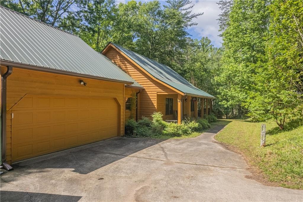 Welcome to this charming ranch-style home situated on a spacious 2.21-acre property, complete with a picturesque pond. Located in a peaceful and serene neighborhood, this residence offers a tranquil retreat from the hustle and bustle of everyday life. Upon arrival, you'll be greeted by a delightful rocking chair front porch, inviting you to sit back and relax while enjoying your morning coffee or witnessing the breathtaking sunsets. The thoughtful layout of this home provides comfortable living spaces and appealing features that enhance its overall charm. As you enter the front door, you'll immediately feel the warm and inviting ambiance of the main level. Every corner of the house showcases attention to detail, with particular emphasis on the tongue and groove ceilings that continue into the master bedroom, creating a cozy and sophisticated atmosphere. The upstairs area boasts exquisite pine hardwood flooring, which adds a touch of natural beauty and charm to the living spaces. Here, you'll find two spacious bedrooms that offer ample room for relaxation and personalization. These bedrooms share a full bathroom, ensuring everyone has space and comfort.
The lower level of this home is a fully finished basement that provides an abundance of additional living space. Featuring a well-appointed bathroom, this basement offers versatility and convenience for various needs. Moreover, two expansive recreation/media rooms await you, presenting endless possibilities for entertaining guests, engaging in leisure activities, or even creating your own cozy home theater. Schedule a Showing Today! If Sunny Parker Properties and/or Team Member shows the property to your client and you are not present, the selling broker commission paid to your selling brokerage shall be 1%.