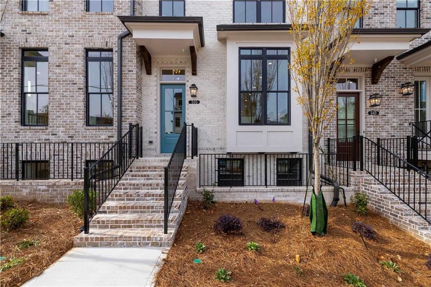 Summer of Savings at Towns on Thompson! MOVE-IN-READY -- DOWNTOWN ALPHARETTA - $35k ANYWAY ON CONTRACTS WRITTEN IN JUNE. Experience elevated living in this impeccably designed townhome, where timeless sophistication meets modern elegance. Situated in the coveted Towns on Thompson—a boutique enclave of just 48 luxury residences—this home offers unparalleled craftsmanship, designer finishes, and an exceptional location between Downtown Alpharetta and Avalon. Step inside to soaring 10-foot ceilings and wide-plank hardwoods that flow seamlessly throughout. The open-concept main level has been thoughtfully curated for both everyday living and refined entertaining. At the heart of the home, the designer kitchen makes a bold statement with GE Café appliances, an industrial slide-in gas range with a stainless steel hood, and sleek Cambria Calacatta Miraggio quartz countertops. Bright white stacked cabinetry, a waterfall-edge island with white base cabinets and farmhouse sink, and custom pendant lighting create a space as functional as it is stunning—flooded with natural light and grounded in warmth and elegance. Adjacent to the kitchen, the entertainer’s dining and living area features a bespoke beverage center with matching quartz and cabinetry, perfect for hosting gatherings in style. The family room is centered around a contemporary linear fireplace, wrapped in custom horizontal shiplap to the ceiling and flanked by built-in cabinetry—offering a sophisticated yet welcoming ambiance. The terrace-level guest suite offers a peaceful retreat with a full private bath and an elegantly appointed walk-in shower—ideal for hosting guests or accommodating multi-generational living. On the upper level, the primary suite is a true sanctuary. Enjoy a spacious sitting area with direct access to a private outdoor deck, designer wall trim, dual custom closets, and a spa-like bath featuring a freestanding soaking tub, an expansive walk-in shower, and high-end finishes that exude understated luxury. This residence seamlessly blends style, comfort, and location in one of North Atlanta’s most desirable communities. Walkable to fine dining, boutique shopping, and vibrant entertainment, Towns on Thompson is the epitome of luxury urban living in Alpharetta. A rare opportunity~ HOA: Dues include Professional Community Management. Landscaping. Comprehensive Building & Structural Insurance. Say Goodbye to roof maintenance, gutter cleaning, painting/staining, & landscaping! Let HOA cover repair & retreat of termite bond, weekly trash & recycling and so much more! *Homeowners have the optional right to join swim amenities at the Foundry* At TPG, we value our customer, team member, and vendor team safety. Our communities are active construction zones and may not be safe to visit at certain stages of construction. Due to this, we ask all agents visiting the community with their clients come to the office prior to visiting any listed homes. Please note, during your visit, you will be escorted by a TPG employee and may be required to wear flat, closed toe shoes and a hardhat. [The Chamberlain]