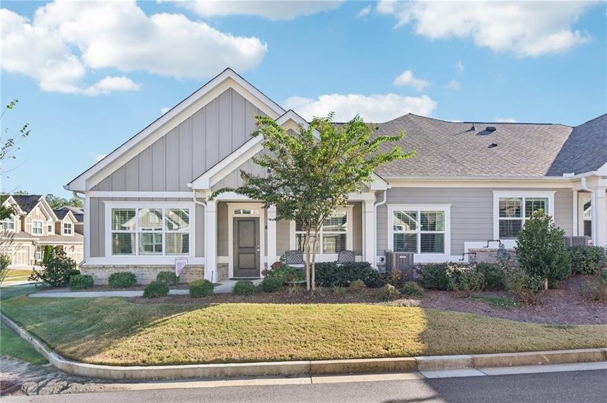 Like new home in the Orchards of Central Park – Active Adult Community Ranch! This beautifully maintained 2,380 sq ft home offers easy, single-level living with thoughtful upgrades throughout. Bright living room has built-ins and a cozy fireplace while formal dining is perfect for entertaining and flex living/office offers multiple possibilities. The main level features an owner’s retreat with a spacious bedroom and spa-style bath with quartz countertops, step-less shower, bench seat, and glass enclosure. A second bedroom with full bath and walk-in closet is perfect for guests. Upstairs, a large loft/bedroom is currently set up as an entertainment space with a pool table, storage, spacious closet, and room to add a kitchenette. The open-concept kitchen with breakfast bar and new dishwasher flows into the family and dining rooms—ideal for entertaining. Wide plank hardwood floors and abundant natural light create a fresh, airy feel. Custom plantation shutters throughout. Enjoy the beautifully landscaped private corner lot from the inviting front porch. Two car garage. Community amenities include a clubhouse with gathering and meeting rooms, fitness room, pool changing area, saltwater pool, and open green spaces. Fantastic location with easy access to GA 400, shopping, dining, medical facilities, and entertainment. Adjacent to Central Park with walking trails, tennis, and a recreation center. HOA covers exterior paint, roof replacement, and weekly lawn maintenance for low-maintenance living. Book your tour today!