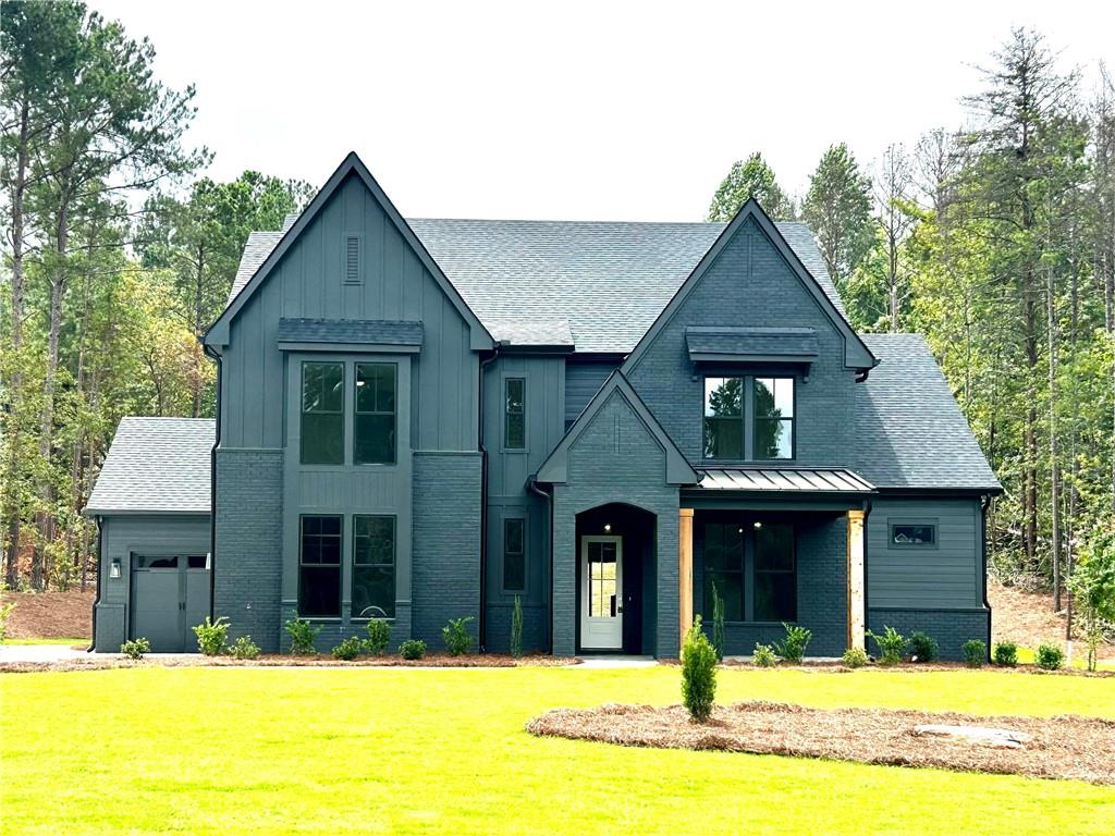 This exceptional NEW CONSTUCTION home offers high-end design, flexible living, and PREMIUM finishes—beautifully situated on a 1.5-acre lot in the GATED luxury community The Manors- zoned for top-rated Jefferson City Schools. The Abigail design features 5 bedrooms, 4.5 baths, a loft, and a 3-car garage. Every element has been carefully selected, with luxury finishes, custom craftsmanship, and attention to detail that elevate this home far beyond typical new construction. A RARE dual owner’s suite layout with a primary suite on both the main and upper level ensures comfortability and flexibility. BOTH retreats boast spa-like baths and custom closets. The main level impresses with 10-foot ceilings and an open, sun-filled layout centered around a designer kitchen with a massive island, custom cabinets and a HIDDEN WALK-IN PANTRY. Just beyond, the spacious family room features a cozy fireplace, built-in bookcases, and sliding glass doors that lead to the covered back porch with a view of the large and PRIVATE backyard. Upstairs, the GENEROUSLY sized secondary bedrooms ALL have private bathroom access and LARGE closets. Each bathroom showcases curated tile details that feel custom and luxurious. A second laundry room upstairs adds extra convenience. Upstairs, the LOFT is a versatile retreat that offers endless possibilities to fit the needs that your lifestyle demands. This home is the definition of turnkey LUXURY and needs to be experienced in person.