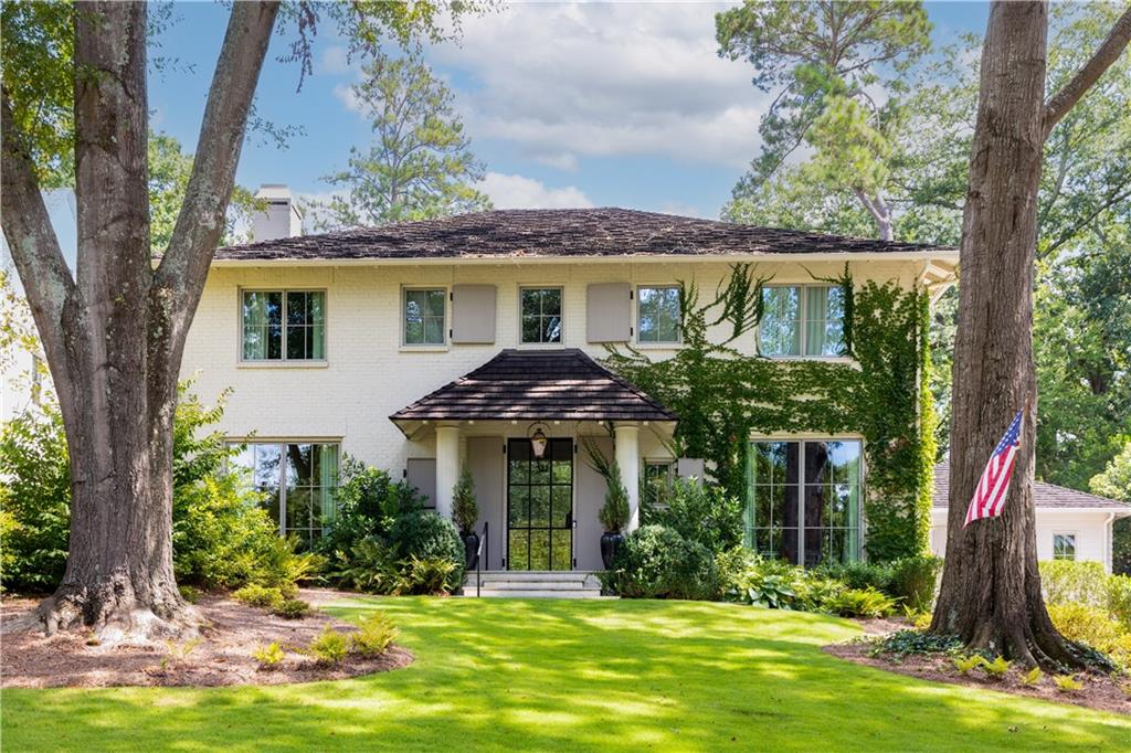 Two stately oaks frame this picturesque home on top of a gentle slope along a sidewalk lined street within walking distance to Bobby Jones Golf Course. Designed in 2018 by Ryan Duffey for a highly respected builder's personal home, the exterior architecture echoes the charm of surrounding early 1900s homes, but the interior has modern finishes, fixtures and features such as oversized windows, light wide plank wood floors, light-drenched living spaces and an inviting glass and steel front entry. Located in the heart of Haynes Manor within view of the Beltline and golf course, the location is simply the best!
A large flat walkout yard has a permit in place for a future pool. Plenty of space for the kids to run + a sport court!
A beautiful octagonal foyer is perfect for displaying artwork as it frames the den and dining room. The breezy family room opens to the modern kitchen. A working pantry and home management office tucked away behind the kitchen helps keep home essentials and family activities organized. A sunny breakfast room encased in windows provides the perfect setting for family meals.
A semi-detached guest cottage with a private entrance and bath was thoughtfully designed to accommodate many needs and can also easily extend into a master-on-main in the future.
The great design showcasing a hidden stairhall is a wonderful experience! Views of the treetops, Beltline, and golf course can be seen through the tall windows as you ascend upstairs to the open sitting area surrounded by 4 bedroom suites and lovely primary suite.
The daylight terrace level features polished concrete floors, a recreation room with surround sound and media area, storage, a mudroom entry from the 3 car garages and motorcourt, as well as a delightful window-lined home office/studio features a conference table, dual workspaces, and a kitchenette. There are many features in this home that are waiting to be discovered, a Cedar roof with 50-year warranty, generator, Control4 Automation, whole house audio, and so much more. Hurry before this one is gone!