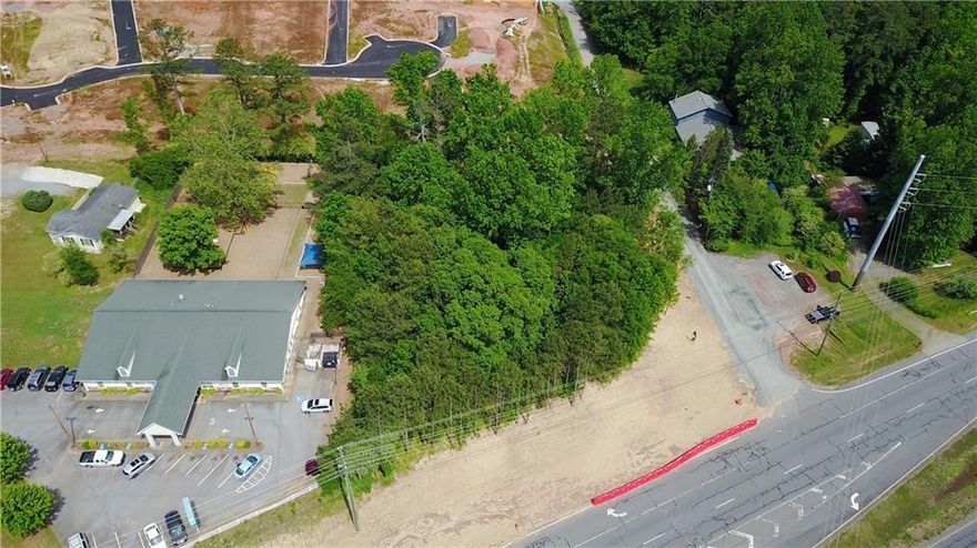 **Prime Commercial Location in Major Highway Corridor!**

Located in Cherokee County, this one-acre site offers high visibility on a major commercial corridor, with over 95,000 vehicles passing daily. Sewer, water, gas, and power are available at the street.

Perfect for retail, dining, or office spaces—capitalize on high traffic and essential utilities.

**Special Offer:** Owner may carry short-term financing on the property.

**Contact us today to get survey and other details.