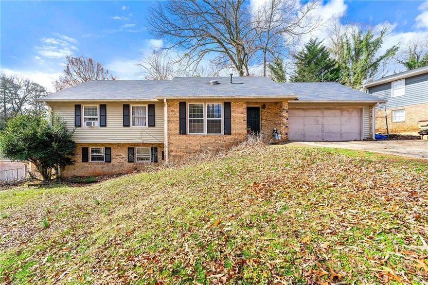 Spacious 5-Bedroom Brick Home in Marietta – Prime Location & Endless Potential! Nestled at the end of a quiet cul-de-sac, this charming 4-sided brick home offers 5 bedrooms and 4 bathrooms, with plenty of room to customize and make it your own. The kitchen features a large island with a breakfast bar and dining area—perfect for gathering. The main level boasts three bedrooms and two baths, including a primary suite. Upstairs, you'll find one bedroom and one bath, plus flexible space for two additional bedrooms, a playroom, or an office. The finished daylight basement adds even more versatility with options for a bedroom, or office. This home is ready for your personal touch. Conveniently located minutes from I-75, I-575, Town Center, KSU, and Kennesaw Mountain.