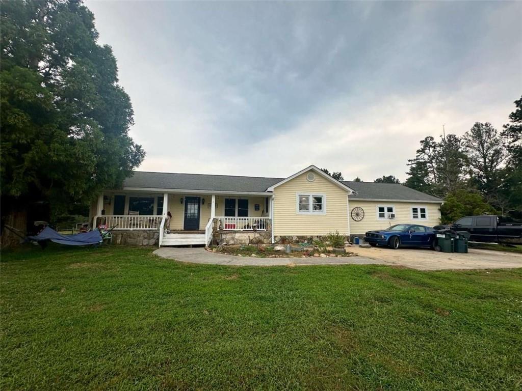 Spacious home on 5 acres located near the Tallapoosa River with 4 bedrooms, 3 full baths, and a dedicated office or small bonus area. Features include a pool with pool house, workshop/garage, and large outdoor space. Tax records reflect 2,501 sq ft, but the enclosed carport brings the estimated total to approx. 3,487 sq ft (buyer to verify). Home needs repairs and updates but offers excellent potential. This is the perfect place to start your mini farm, homestead, or simply enjoy country life with a little sweat equity! Sold AS-IS.