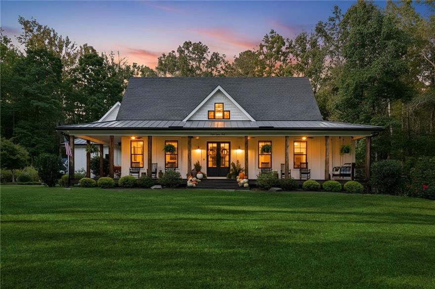 Welcome to your dream home! Perfectly positioned in one of Cherokee County’s most desirable locations and zoned for the award-winning Creekview High School, this 2017 custom-built farmhouse is a rare find. Just minutes to Milton, Alpharetta, and Ball Ground.
Sitting on 5.48 acres of pristine, landscaped land, this 4-bedroom, 3-bathroom estate is a peaceful retreat with modern amenities, timeless charm, and flexible living space that fits your lifestyle today—and grows with you tomorrow.
This home features a thoughtfully designed open-concept layout with expansive great room, sunroom, and bonus room, inviting spaces with vintage distressed hardwood floors throughout the main level. First-floor owner’s suite featuring a spa-like bath, walk-in shower, custom vanity, and spacious walk-in closet, Gourmet kitchen with stone countertops, high-end appliances, and ample cabinetry—perfect for the home chef! Seamless flow between the living, dining, and kitchen areas. Beautiful sunroom off the kitchen with a wood burning fireplace. This home is ideal for gatherings and entertaining!
Upstairs Living & Flex Space:
This unique home offers two separate upstairs entrances for maximum versatility: there is a Private suite above the garage—ideal for guests, a home office, or playroom and a Second staircase leads to two oversized bedrooms, a full bath, and a bonus room perfect for a game room or additional office space!

Downstairs there is 2,000+ sq ft partially finished basement with endless possibilities: in-law suite, gym, theater, bar/kitchen—a blank canvas for your vision!

Some additional features of the property include Control4 smart home system with integrated Sonos speakers throughout, Irrigation system in front and side yards for easy maintenance

This property is a true gem and has its own peace with this outdoor oasis, wrap-around porch for morning coffee, evening wine, and everyday relaxing.

 Additional Opportunity:
A second brick farmhouse-style home with 3 bedrooms and 2 bath on the property is also available for purchase with the main home. Perfect for multi-generational living. This home features its own 2.2 acre lot with garden area and fenced back yard.
Note: This second home will not be shown without proof of funds or pre-approval for both properties.

Location Highlights:
Minutes to top-rated schools, shopping, dining, and major highways
Ideal for those seeking space, privacy, and convenience in one incredible package!

Don’t Miss This Rare Opportunity!
Whether you’re looking for your forever home, a multi-generational property, or a peaceful luxury escape close to it all, this stunning farmhouse offers more than just a home—it’s a lifestyle.