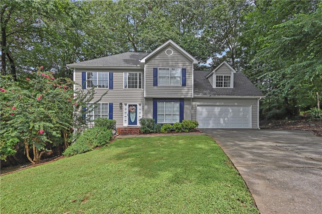 Welcome to this beautifully maintained 4-bedroom, 2.5-bath home, ideally situated on a stately cul-de-sac in the desirable Lawrenceville/Suwanee area. From the moment you enter the two-story foyer, you’ll be welcomed by a spacious layout featuring a formal living room to the left and a banquet-sized dining room to the right.
The inviting family room showcases a charming brick fireplace with gas starter and opens to a private deck overlooking the backyard — perfect for relaxing or entertaining. Hardwood floors span the entire main level, and plush designer carpet continues throughout the second floor. The kitchen is both stylish and functional, offering quartz countertops, a farm-style sink with a designer faucet, updated hardware, and newer stainless steel appliances including a refrigerator, stove, dishwasher, and Insinkerator disposal. A spacious laundry room off the kitchen adds convenience and extra storage.
Upstairs, the serene primary suite includes a large walk-in closet and a well-appointed bath with quartz countertops and LVP flooring. Three additional generously sized bedrooms feature updated lighting and share a well-located hall bath.
The home also features a full, dry basement that is already framed and stubbed, offering excellent potential for a media room, in-law suite, home office, or additional living space. Additional highlights include a double-car garage with epoxy-finished floors and a newer garage door.
Sitting on a unique double lot (parcels 52 and 53), this property offers expanded outdoor space, a storage outbuilding, and extra privacy. Conveniently located near I-85 and GA-316, with quick access to restaurants, shopping, downtown Lawrenceville, Suwanee Station, and the Mall of Georgia.
Don’t miss this exceptional opportunity!