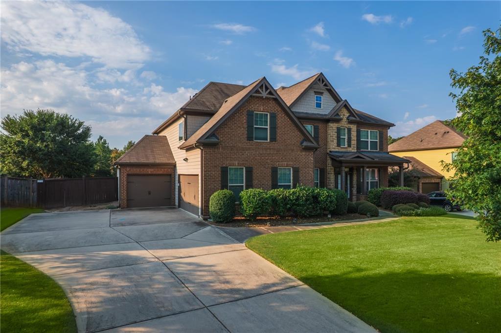 Impeccably maintained 5 Bed / 4 Bath Craftsman home, built in 2016 and perfectly designed for modern living in the Highly Desired Sequoyah High School District and Hickory Manor Subdivision. Featuring a stunning mix of brick, stacked stone, fiber cement siding, shake, and rough sawn accents, this home’s curb appeal is as impressive as its interior.
Situated on a .27-acre level, fenced lot in the highly sought-after Hickory Manor swim community, this residence is conveniently located near top schools, shopping, and dining.
** Interior Highlights **
Grand two-story foyer welcomes you into expansive, light-filled living spaces.
The gourmet Kitchen is the true heart of the home with Electrolux stainless appliances, Whirlpool 4-door refrigerator, large island with breakfast bar, abundant cabinetry, walk-in pantry, and a mudroom/drop zone.
Open-concept living connects the Kitchen, Breakfast Room, and Great Room with stacked-stone gas fireplace flanked by custom built-ins.
Covered rear patio with fireplace, ceiling fan, recessed lighting, and mounted TV for year-round entertaining.
Formal Living Room with French doors—perfect for an office or flex space.
Main level guest suite with full bath.
* Upstairs Retreat *
Spacious Primary Suite with vaulted ceiling, spa-like en-suite bath including double vanity, oversized shower, soaking tub, and private water closet.
Huge walk-in closet with built-in shelving and racks.
Convenient upstairs laundry with access from both hallway and Primary Suite.
Bedroom 2 with private en-suite bath.
Bedrooms 3 & 4 share a well-designed Jack & Jill bath.
Oversized Bonus Room—ideal for media, office, or additional lounge space.
Additional Features -
3-car garage with one front-facing and two side-facing bays.
Extra-wide driveway for easy parking.
Move-in ready condition with exceptional craftsmanship throughout.