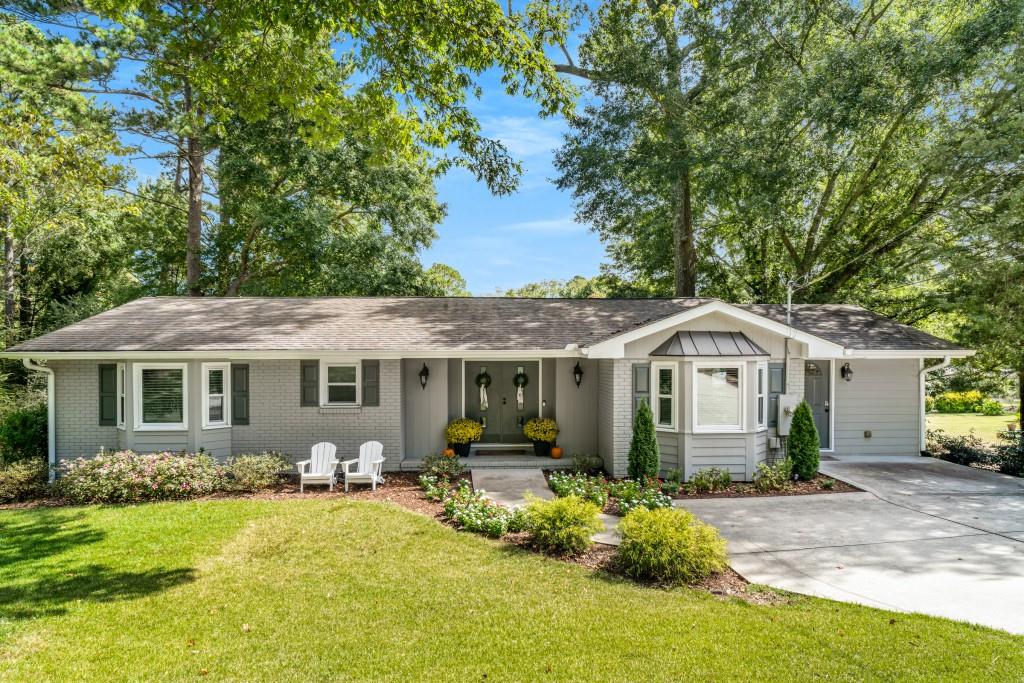 Fantastic turnkey property in Sandy Springs - move right in! This 3BR/2.5BA features open concept living with the kitchen island opening up to a dining area and large primary living room. An oversized conditioned sunroom, multiple decks, firepit, and basement all make this home perfect for entertaining. The two secondary bedrooms are jack-and-jill with ample closets, and the primary is en-suite with a large closet and private bath. The unfinished basement boasts an incredible amount of storage for a home of this size. Very well upkept inside and out, you'll enjoy a large private backyard in a very flat walkable neighborhood with friendly neighbors. This is also one of the only homes on this side of the street that is connected to public sewer instead of septic. In the area, you'll love Abernathy Park with a great playground, City Springs with excellent restaurants and entertainment, very commutable to Buckhead, Midtown, or Alpharetta via GA400.