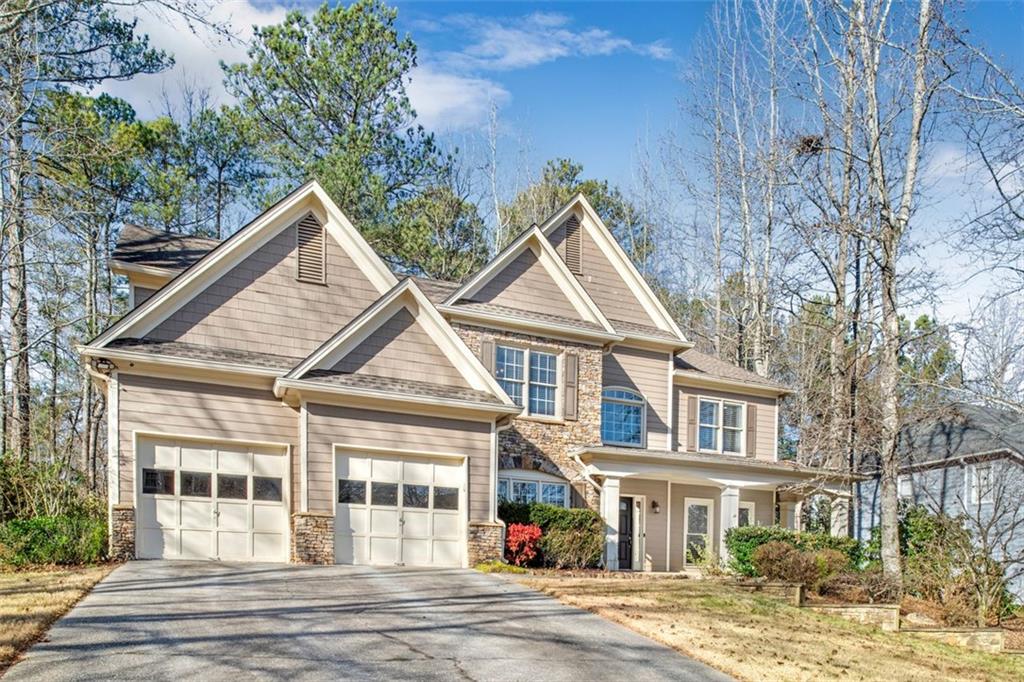 Looking for the best backyard in Johns Creek? You have found it! Sitting on almost an 1/2 acre of land, the backyard is a beautifully wooded private oasis and escape. Enjoy your morning coffee in the amazing screened porch. The Community features a swimming pool, tennis court and playground. It has modern updates such as heated master bath floors, hardwood floors and open kitchen that leads to the large family room! The upstairs AC unit is only 4 years old. The house is located in a top ranked Fulton County school district! Convenient to interstates, hospitals, shopping, dinning! This home is not to be missed!