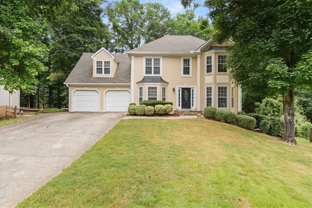 Tucked at the end of a quiet cul-de-sac and backing up to protected Corps of Engineers land, this 5-bedroom, 3.5-bath traditional beauty in Eagle Watch is where peaceful living meets everyday comfort—with space for everyone and every season of life.
Step inside to a welcoming foyer, a light-filled living room, and a separate dining room perfect for hosting holiday dinners or low-key Sunday brunch. The white kitchen feels bright and timeless with granite countertops, a breakfast island, and a cozy breakfast nook that overlooks the backyard.
The spacious living room features floor-to-ceiling windows and a wood-burning fireplace—the kind of space that invites you to slow down and stay a while.
Upstairs, you'll find four generous bedrooms, including a large primary suite with a walk-in closet, double vanity, soaking tub, and separate shower—because you deserve a retreat that actually feels like one.
The finished basement offers a private fifth bedroom, full bath, and its own exterior access, making it perfect for in-laws, guests, a teen suite, or even a home office with its own entry.
Outside, the oversized back deck is an entertainer’s dream—big enough for grilling, lounging, and dining under the stars. The fenced, level backyard is made for playdates, pets, or peaceful afternoons soaking in the privacy and nature that surrounds you.
All this, plus access to Eagle Watch’s top-tier amenities: three swimming pools, tennis courts, golf course, playgrounds, a swim team, and year-round community events.