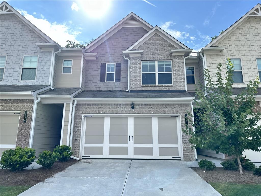 This SUPER AWESOME WELL MAINTAINED, Two Year Old, Looks Brand New, Ready to move in, located in the most sought after Park at Camden community. This 3 bed 2.5 bath Town home features an open-floor plan concept, with an open dining room, family room and Enjoy your contemporary kitchen complete with stainless steel appliances, granite counter tops, and fashionable hardwood floors throughout the first floor. Upstairs features Huge master bedroom boasts private wooded views and a luxurious primary bathroom featuring dual vanities, separate tub/shower, and walk in closet! Secondary bedrooms are spacious and bright with a Jack & Jill bathroom. Laundry room conveniently located upstairs. This house also comes with a private backyard with patio fully usable making this home perfect for indoor/outdoor entertaining! Park at Camden is conveniently surrounded by plenty of shopping, dining, and entertainment, the Outlet Shoppes, Shops at Trikum, The Centre at Woodstock, and several area golf clubs. This subdivision also allows easy access to dog parks and Dupree Park, an area featuring basketball and tennis courts, fitness stations, and nature trails: a place perfect for hiking and biking. This townhome is a must see! Ready for a quick and easy closing!