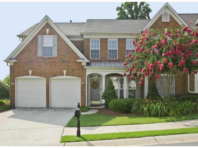 Amazing end unit that was originally model home. Popular master on main plan, granite countertops, custom closet and pantry, oversized patio with privacy fence, two additional bedrooms, loft office and full bath up, two car attached garage, new carpet and designer colors. Shows beautifully.