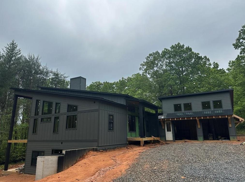 Fairview at Morganton - Single Family Gated Community with Paved Roads in Downtown Morganton - Less than 1 mile from Lake Blue Ridge & Morganton Point Rec Area! 4 Bed 3.5 Bath | 2 Car Garage (side entry) | 20 Ft Ceilings | 3 Fireplaces (indoor & Outdoor) | Quartz | Engineered Hardwoods | Open Floor Plan | Master On Main | Owners Free Standing Tub | Walk Out Basement | Pool Lot (if desired) | Backs up to woods | Custom Home | Estimated Completion: September 2025!