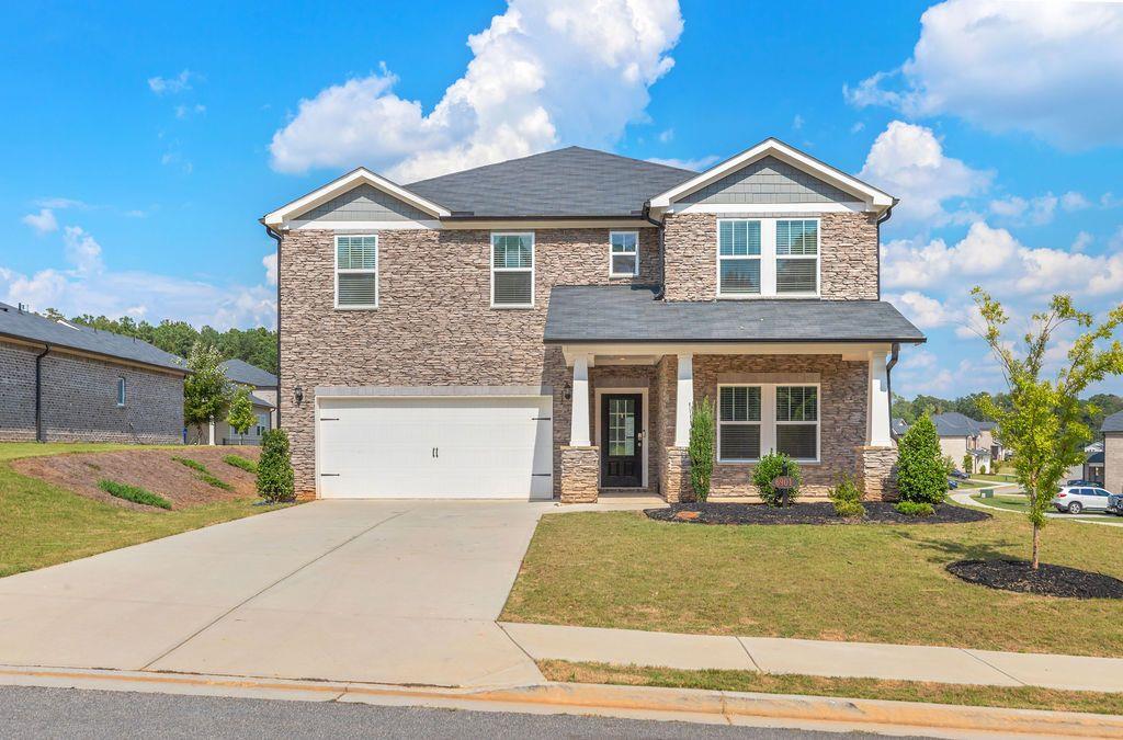 This is your opportunity to own the largest floor plan in Creekside at Oxford Park in a bustling park of South Fulton. This
3-sided brick Taylorsville floorplan, built in 2022, feels like new and is loaded with energy-efficient features. Offering over
3,200 sq ft, the home includes 5 bedrooms and 4.5 baths with a dedicated guest suite and full bath on the main level. The
layout is perfect for multi-generational living or guests. Spacious and with tons of room for storage, this integrated living
space flows seamlessly from the kitchen into the living and dining spaces. A flex loft upstairs adds versatility for a media
room, office, or play area, while the primary suite offers an en-suite and large walk-in closet. Designed with Meritage’s
advanced energy-saving systems. The home is still under the builder’s structural warranty and has been designed to including features such as spray foam
insulation, high-efficiency HVAC, and smart home integration providing long-term savings for the new homeowner. Creekside
at Oxford Park offers easy access to trails/parks, local shopping and dining in Downtown Fairburn. The community has it's
own pool, playground and clubhouse.