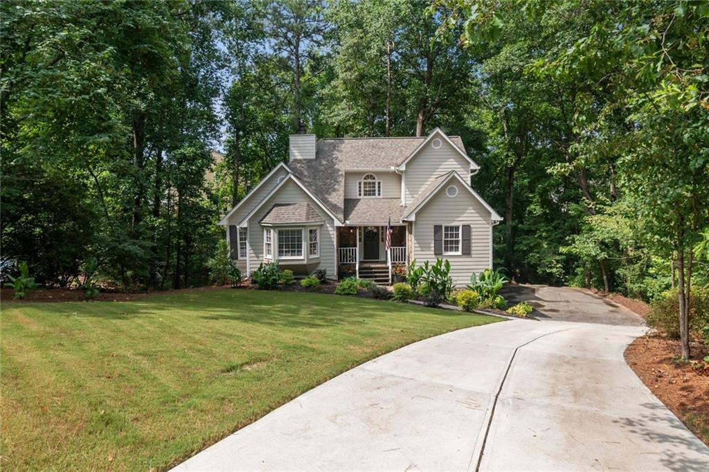 WOW! don't miss this Cape Cod Beauty! Very PRIVATE large lot in the heart of Everything! This house has been totally updated. Tons of storage.
It is in pristine Condition - This Beautiful 3-bedroom, 2 bathrooms with 2 additional flex rooms/bedrooms located in the partially finished basement is Move-in Ready. Nestled in a Serene, Wooded Neighborhood at the end of Cul De Sac conveniently located to I-575 & HWY 92. The Newly Renovated Interior boasts Freshly Painted Walls and Ceilings throughout the home, New LVP flooring in the Kitchen, New Carrera Quartz Countertops, and New GE Stainless Appliances. The large Deck and private large Backyard is an Entertainer's Delight! The Spacious Primary Owners Suite features a Sitting Area and Newly Renovated Spa Inspired Bathroom with Koehler Soaking Tub and a separate Shower. The Partially Unfinished Basement with external access offers ample Flex Space for Yoga/Exercise Room, office, Arts and Crafts or Additional Bedrooms or Abundant Storage. The home features a 1.5-year-old roof, NEW Garage Doors, NEW Light Fixtures/Ceiling Fans Throughout, 1 year ago the exterior and interior were freshly Painted, NEW Partial Driveway, and Newly Landscaped Front Yard. The HVAC is on an annual contract and has been well maintained. The Neighborhood Roads are Newly Paved. Welcome Summer while enjoying the Community Pool and Playground.