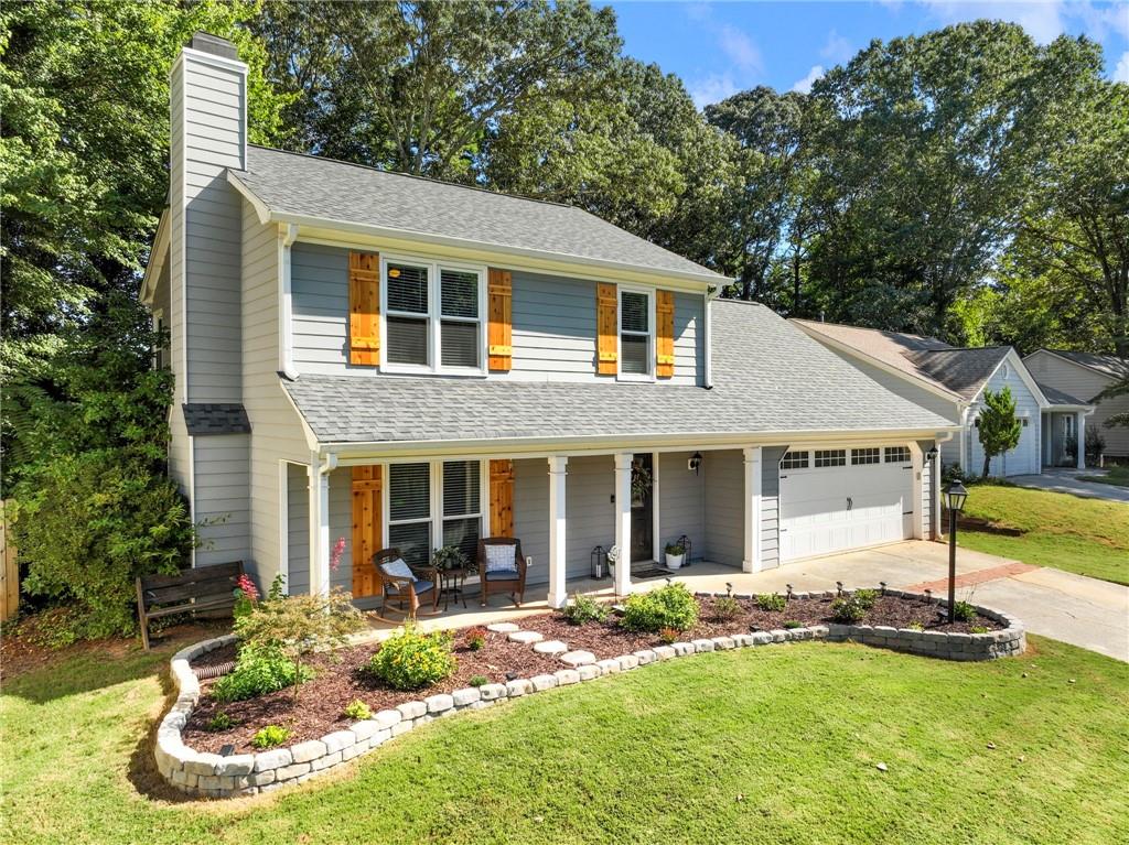 RENOVATED ON INTERIOR AND EXTERIOR! NO HOA! This John's Creek gem truly has it all. Kitchen was renovated in 2021 including new white shaker cabinets, quartz countertops, tile backsplash, and all new appliances. Master ensuite was also renovated in 2021 to include an oversized tiled and frameless shower and new vanity. Exterior was renovated in 2020 to include new roof, all new windows, and new siding. 2020 water heater. New shutters 2024. New flooring throughout main floor August 2025. Light fixtures have also been updated along with a drop zone area in 2024. This is a warm, cozy floorplan with a fireplace adorning the living area, flanked by built-in bookshelves. Dining room has views into kitchen and living areas for a seamless flow. Unwind on your back screened-in patio and enjoy your private, fenced yard. A cute shed can house your lawn equipment. New front yard landscaping 2025. Excellent schools! Walking distance to shopping and dining. Ten minutes to Avalon. Don't miss out!
