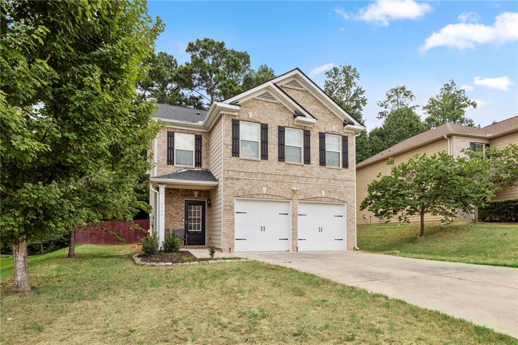 Charming 4BR/2.5BA brick-front home in Fairburn! Step into an inviting foyer with bamboo hardwoods flowing through the main areas, stairwell with wrought iron spindles, upstairs hallway, and master suite. The open family room overlooks the kitchen featuring cherrywood cabinetry, stainless steel appliances, and granite countertops—ideal for entertaining. Upstairs, the spacious master suite includes a sitting room perfect for an office or reading nook. The spa-inspired bath offers a jetted tub, tile shower, and double vanities. A beautiful blend of style, comfort, and function awaits at 6608 Oak Hill Pass!