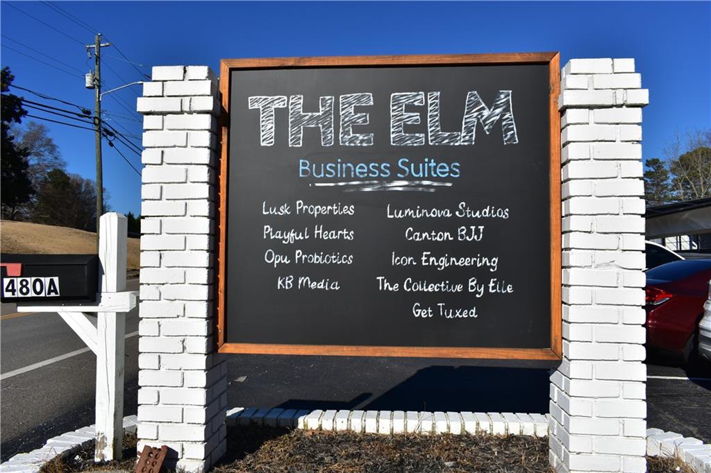 Investment deal in mixed-use center with professional office and retail space. Located in the renovated historic Ball Ground Elementary School, re-named "The Elm" and making for unique feel of property and adaptive re-use of historic building. 11 current tenants, and 13 total tenant spaces ranging from 644SF to over 8,000SF with current occupancy rate of 89%. These private office suites have been fully renovated and are suitable for both small and growing businesses with some sharing access to common areas, including bathrooms and some with fitted with fully private bathrooms. The two suites remaining for lease include 1700+SF "lunchroom" - an open area space that is perfect blank space for incoming business, and a 990SF space fit for commercial kitchen, which could easily be fitted for offices with private bathroom.
Annualized Proforma NOI, based on 100% occupancy is over $350,000 with all leases in place having annual escalations of at least 3%. Common Area Maintenance Fees are paid by all tenants and cover expenses such as utilities, landscaping, trash services, security and janitorial expenses.
The Elm is located a short drive from Interstate-575, just over a mile and a half away, which connects to Interstate-75 and Hwy-515, for easy commute from Canton, GA or Jasper, GA. Ball Ground is seeing an increase in growth as it is located in one of the more rapidly growing counties in the state of Georgia with an average yearly population increase over 6% each year since 2020 and healthy median household income over $100k.