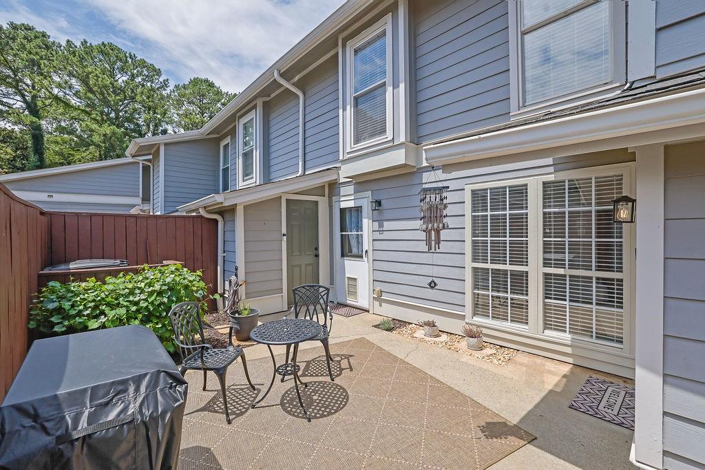 Welcome home to this charming East Cobb condo located in the highly sought-after Walton School District! This beautifully updated home offers the perfect blend of comfort and convenience. Step into a private, gated courtyard with exterior storage before entering the inviting living space. The updated kitchen features granite countertops, stainless steel appliances, and a modern finish, perfect for entertaining or everyday living. The roommate-style floor plan provides privacy with two spacious bedrooms, each with its own en-suite bathroom. Laundry is conveniently located on the main level. Enjoy access to a community pool, plus easy proximity to shopping, dining, grocery stores, and more. Just under 15 minutes to downtown Roswell and the Chattahoochee Nature Center! No rental waitlist at this time, making it an excellent opportunity for investors or homeowners alike. HOA covers water and sewer, insurance on the building, pest and termite control, pool, trash pick-up, and exterior maintenance including roof. Don’t miss this move-in ready gem in one of East Cobb’s most desirable communities!