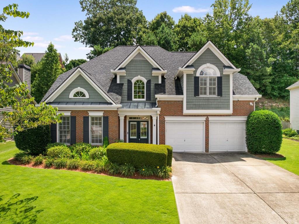 This is truly a thoughtfully updated home in the highly sought-after King Valley at Vinings swim/tennis community, just minutes from the award-winning King Springs Elementary. From the moment you enter, you'll be welcomed by soaring ceilings and fresh interior paint, creating a bright, welcoming feel. New wide-plank wood floors (2025) run throughout the main living spaces, enhancing both warmth and elegance. Elevated lighting and designer fixtures, along with upgraded light switches and dimmers, add a touch of modern style throughout the main level.
The white kitchen, updated in 2025, features quartz countertops, a sleek backsplash, and stainless-steel appliances—perfect for everyday living and entertaining. Separate formal living and dining rooms offer additional comfort and function. A versatile main-level bedroom includes a full bath and an updated closet with custom Elfa shelving (2014), ideal for guests or a home office. The full bath on the main has been refreshed with reglazed tile and tub, plus a comfort-fit height commode.
Upstairs, the oversized primary suite impresses with a stunning tray ceiling and two premium custom California Closets (2016 & 2018), each designed with integrated electrical outlets, glass-topped vanities, and thoughtful built-in extras. The spa-inspired primary bathroom, renovated in 2021, offers dual vanities, a heated towel rack, custom towel nooks, and a modern steam shower with dual shower heads, a full-body jet system, two handhelds, and a rainfall showerhead. The top-of-the-line jetted tub provides hydrotherapy options with air jets, massage settings, or gentle waves. A lighted full-length mirrored cabinet with built-in electrical outlets adds a practical and elegant touch.
Two additional spacious bedrooms are connected by an updated Jack-and-Jill bath, which features modern fixtures and a reglazed tub. All commodes throughout the home have been upgraded to comfort-fit height. New carpet (2025) has been installed throughout the upper level, and convenient dormer storage offers smart, out-of-sight organization.
Extensive upgrades continue outside. The roof is approximately 7–8 years old and includes gutter leaf protectors. New Lennox HVAC systems with UV lights and allergen filters have been professionally maintained since installation, with a new AC capacitor added to the largest unit in June 2025. A tankless hot water heater ensures endless hot water. The home is protected by a transferable Estes 1-Year Home Maintenance Agreement covering plumbing, electrical, and HVAC systems. Garage upgrades include a refrigerator that stays and a direct electric circuit for a stand-alone freezer. Attic insulation was replaced with anti-pest insulation in 2019 for improved energy efficiency.
The professionally landscaped backyard is both beautiful and functional, with a full drainage system installed in Fall 2023 and additional side drainage in Spring 2024, plus French drains at most downspouts. A lush Zoysia lawn and private courtyard-style setting make outdoor entertaining and low-maintenance living easy. Front and back irrigation systems have been upgraded to app-controlled Rachio wireless zones.
Additional peace of mind comes from a current Northwest Termite Repair and Retreat Bond and a Peachtree Pest Exclusion 1-Year Warranty (as of June 2025). This home is ideally located on a quiet, no-thru street away from pool and clubhouse activity, in a walkable neighborhood where kids can safely ride bikes and enjoy easy strolls to King Springs Elementary.