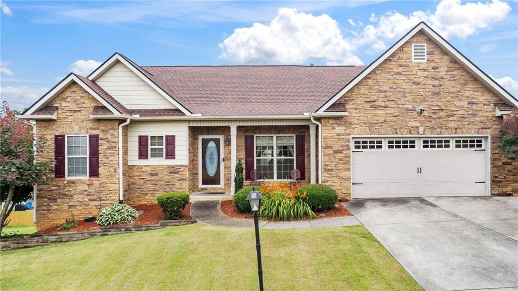 Welcome to this beautifully maintained home nestled in a quiet, amenity-filled community featuring a pool and park. Zoned for highly regarded Cass Middle and Cass High Schools, this property offers both comfort and convenience. The spacious open-concept main level boasts wood floors, a fireplace in the living room, a separate dining area, and a kitchen with a large island and plenty of cabinet space—perfect for everyday living and entertaining. The primary suite is conveniently located on the main level for easy access. Downstairs, the finished daylight basement includes two full bedrooms, a full bathroom, and a second living area, ideal for multi-generational living, a guest suite, or entertaining space. Step outside to enjoy a newer deck that overlooks a beautifully landscaped yard. Recent updates include a newer water heater and a roof that's only five years old, offering both style and peace of mind. This home blends thoughtful design with a prime location—don’t miss your opportunity to make it yours!
