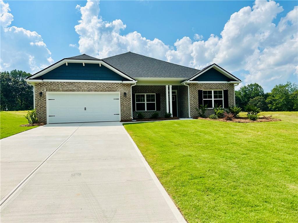 Welcome to this "Park Place Sanctuary" - Charming and Modern 4 Bedroom / 2 Bed - Ranch Retreat in the Park Place community! Envision waking up in your 2100 sq. ft. dream home in Park Place, affectionately known as "The Friendly City", Bowdon, GA. Designed to last and crafted with care, this home blends cozy nooks with open gathering spaces, inviting laughter, stories, and Sunday dinners. Natural light fills the walk-in foyer and spacious dining room leading into the great open-concept family room, with a gorgeous granite countertop island awaiting your gourmet meal prep and a pantry just waiting to be filled. This beautiful split-bedroom layout offers 2 spacious secondary bedrooms and a full bath as you walk into the hallway. The amazing owner's suite has a luxurious soaking tub, a separate shower, and a walk-in closet. This thoughtfully designed space offers both privacy and connection, creating the perfect atmosphere for modern living. Home features 1 additional bedroom that may be suitable for an office / study. Picture yourself unwinding on your covered lanai, overlooking a peaceful and spacious backyard for outdoor living and family barbeques. Whether hosting lively gatherings or enjoying a quiet evening, this home is designed to enhance every moment of your life. Built for quality and efficiency, "The Park Place Sanctuary" features architectural shingles for durability and two water heaters to ensure lasting comfort and peace of mind. You'll enjoy natural light throughout the day, making every room feel warm and inviting. Situated in Carroll County, minutes from I-20, local Bowdon schools, Tanner hospitals, the University of West Georgia, and West Georgia Technical College. Along Georgia State Routes 100 and 166, Bowdon combines small-town charm with convenient access to nearby communities, local downtown restaurants, and boutique shops. Near Carrollton Greenbelt walking trails, Little Tallapoosa, Hays Mills, and John Tanner Parks - great for outdoor life, hiking, biking, walking, boating, and fishing. USDA financing eligibility, and only $1,000 in earnest money required, making homeownership affordable and attainable. This is your opportunity to own a residence that perfectly blends style, efficiency, and affordability. Schedule your private tour today and start making memories within the "Park Place Sanctuary."