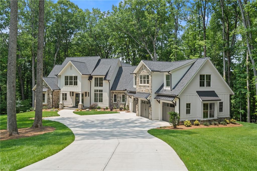 Timeless, French-Country Estate currently under construction with 5 bedrooms and 5 1/2 baths. Nestled beneath 3.10 acres of majestic hardwoods and overlooking lush North Fulton farm land in the coveted area of Milton, GA horse country. Both the owners' suite and a guest suite are located on the main level with private access to the guest suite. Gourmet kitchen with Thermador appliances, a walk-in pantry and prep-kitchen. Custom handcrafted beams run throughout the living area. Enjoy your private rear porch with stone fireplace and tile floors overlooking a level backyard. There is a full daylight basement and attached 3 car garage with room for additional storage. Rare private lot, located at the end of a cul-de-sac in a well established Milton luxury community, Hickory Crest Subdivision. You are only a stones throw away from the fabulous Union Hill Grill, 7 Acres BarNGrill and Publix shopping center. Please GPS Hickory Pass , Alpharetta/Milton, Georgia 30004 (without the street number) for driving instructions. GPS with the street number will likely direct you through the woods instead of the street/driveway.